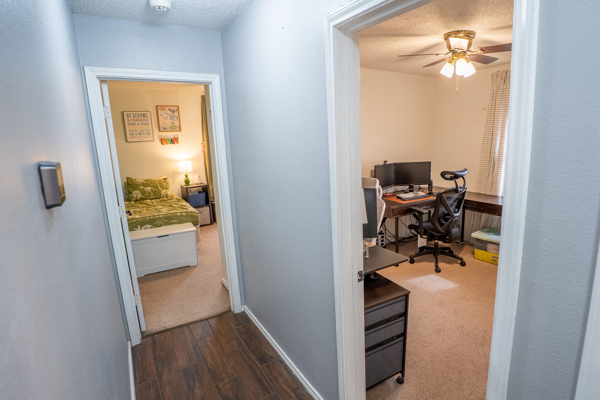 1609 78th Street Lubbock, TX 79423 - Photo 24 of 36 a view of a hallway to a livingroom and a dining room with furniture