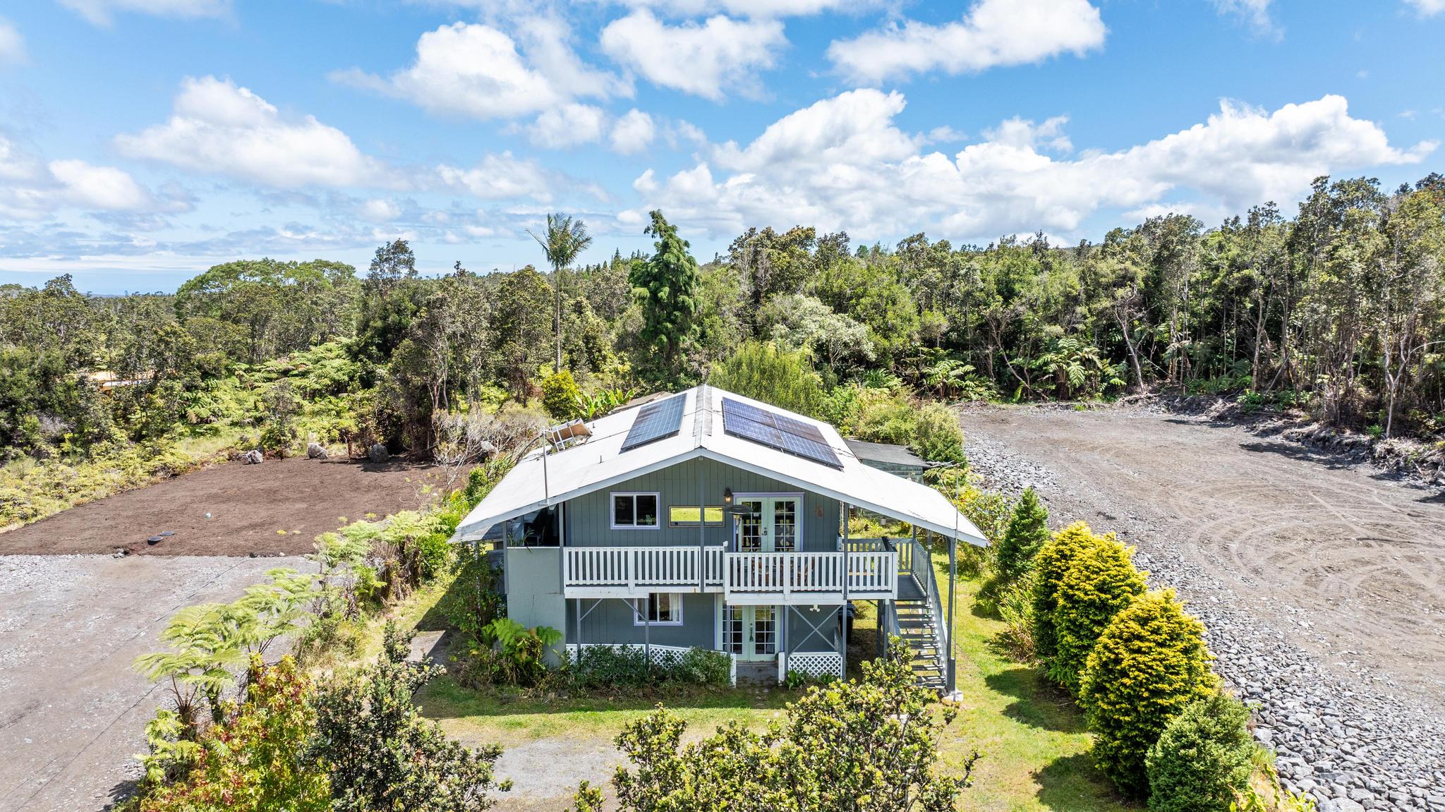 11-3681 Old Volcano Road Volcano, HI 96785 - Photo 1 of 26 a front view of a house with a yard