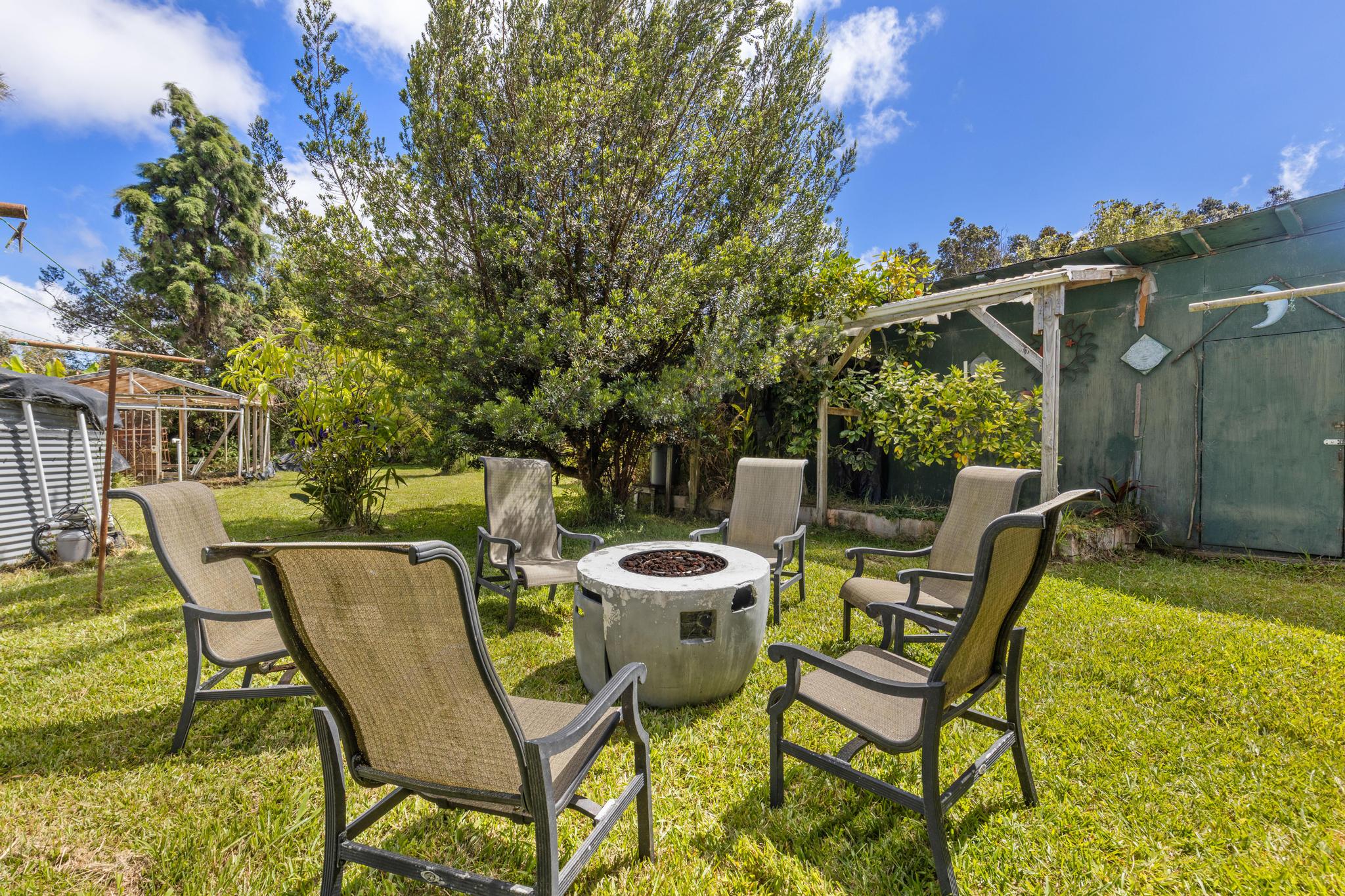 11-3681 Old Volcano Road Volcano, HI 96785 - Photo 11 of 26 a patio with a yard table and chairs