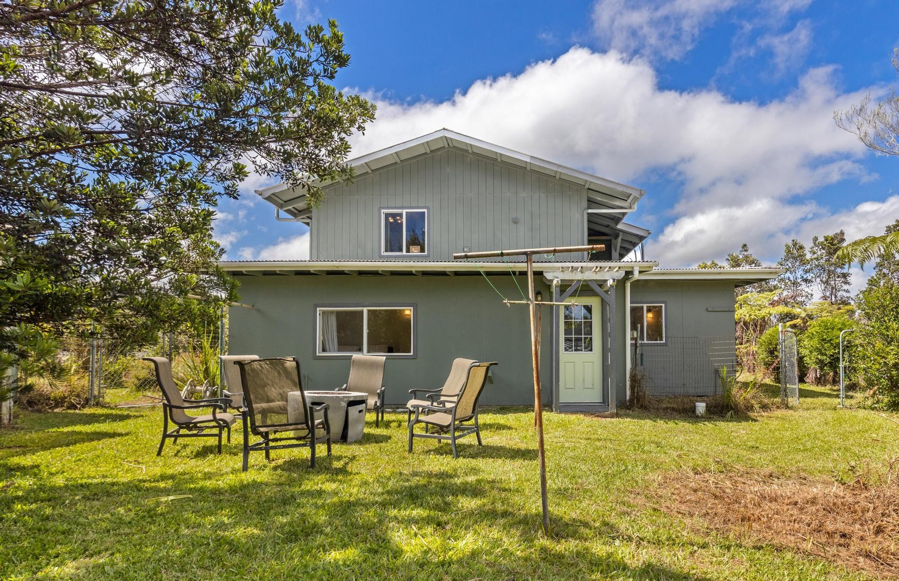 11-3681 Old Volcano Road Volcano, HI 96785 - Photo 13 of 26 a backyard of a house with table and chairs