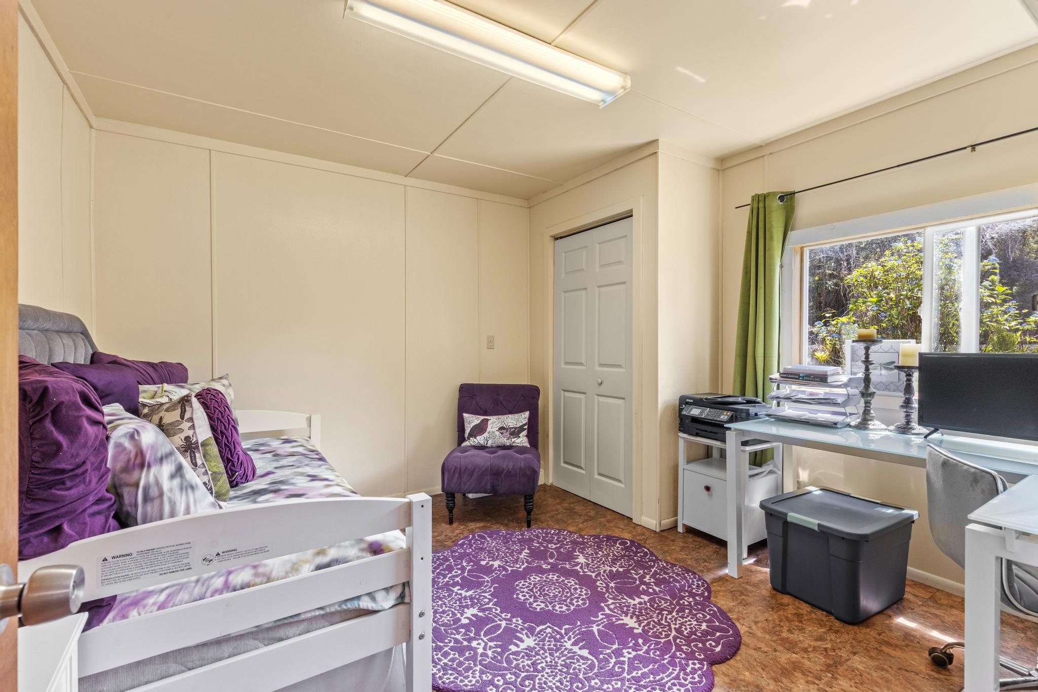 11-3681 Old Volcano Road Volcano, HI 96785 - Photo 25 of 26 a living room with furniture and a flat screen tv