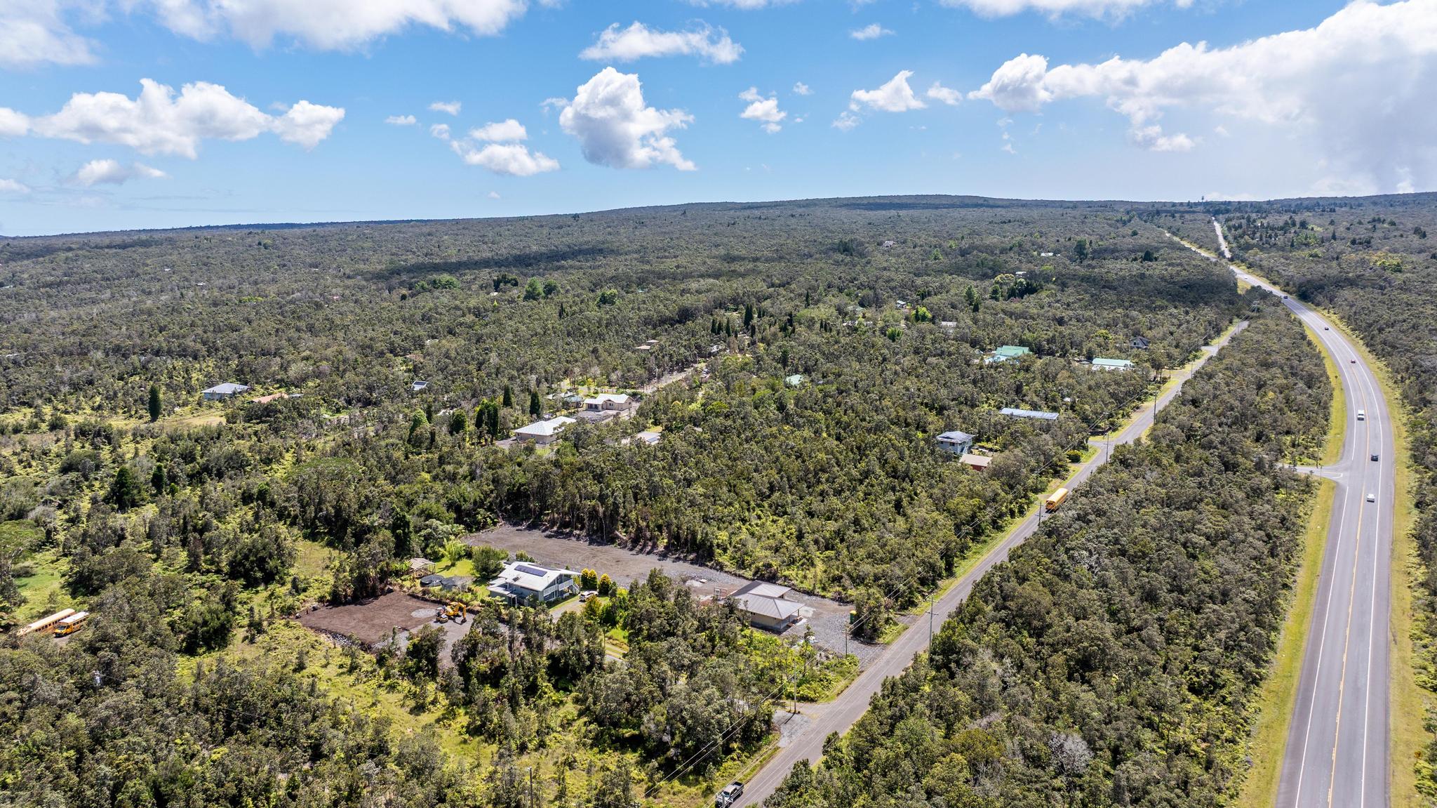 11-3681 Old Volcano Road Volcano, HI 96785 - Photo 26 of 26 an aerial view of a residential houses with yard and mountain view in back