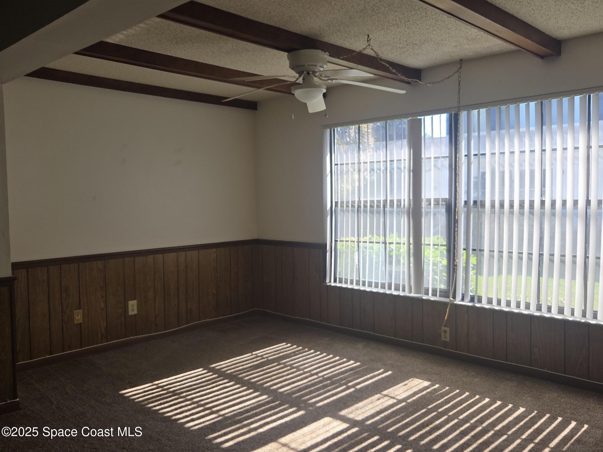 255 Kings Way Satellite Beach, FL 32937 - Photo 11 of 34 a view of an empty room with a window