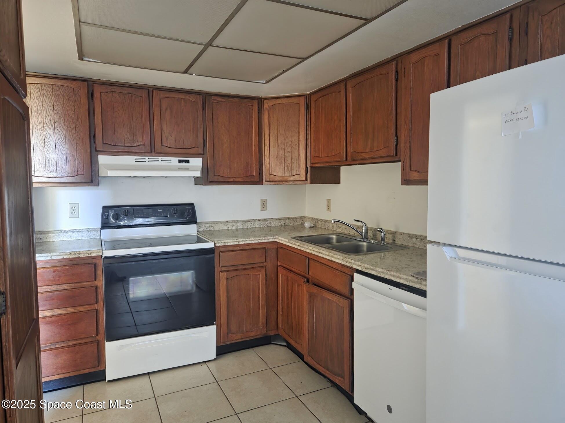 255 Kings Way Satellite Beach, FL 32937 - Photo 16 of 34 a kitchen with stainless steel appliances granite countertop a refrigerator sink and stove