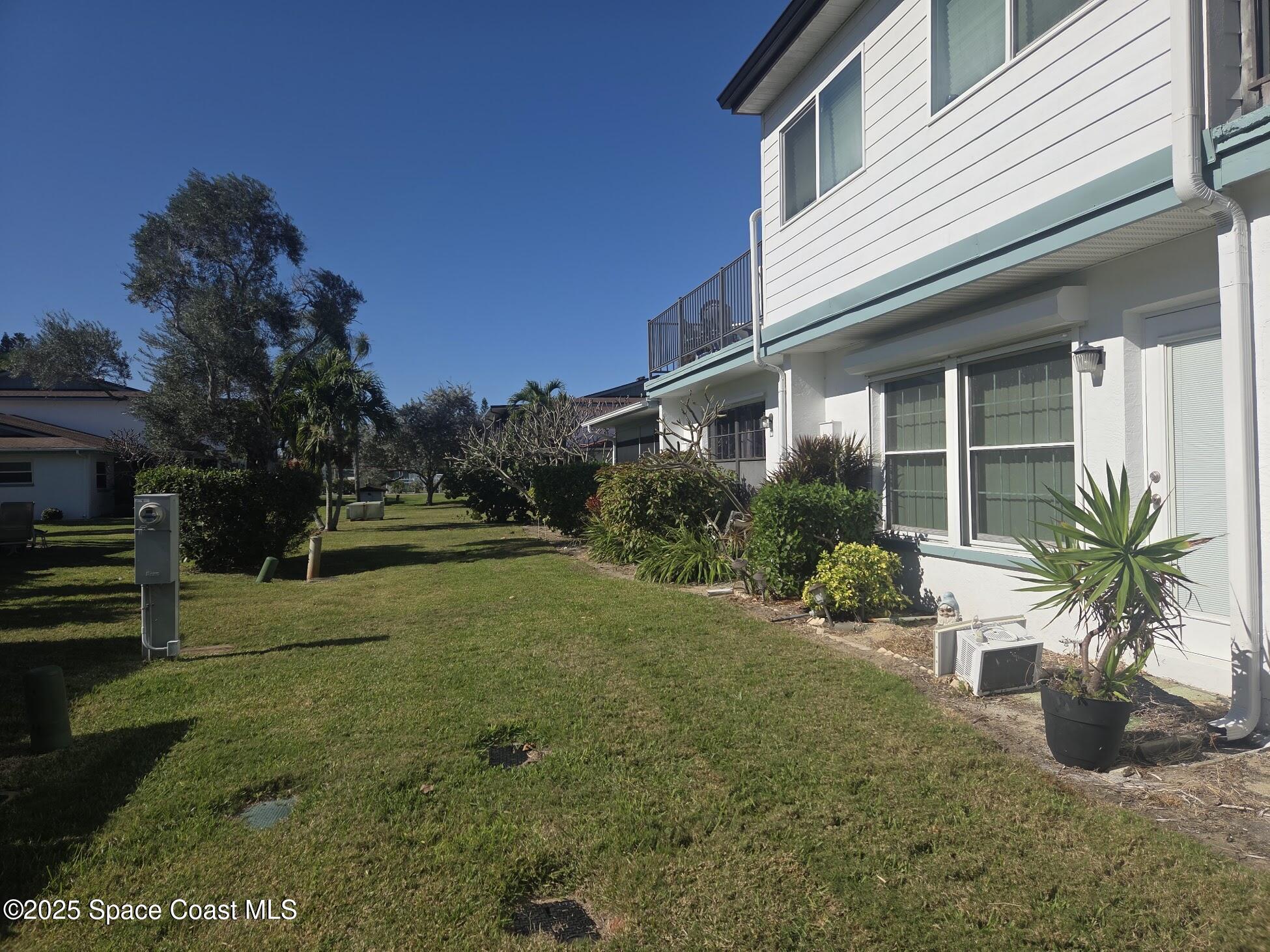 255 Kings Way Satellite Beach, FL 32937 - Photo 6 of 34 a view of a house with backyard and garden