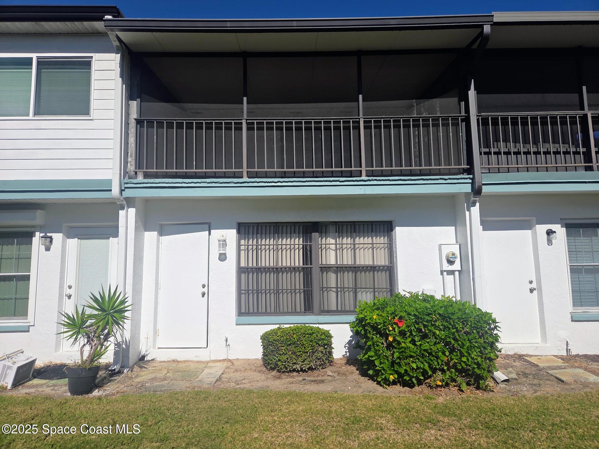 255 Kings Way Satellite Beach, FL 32937 - Photo 7 of 34 a front view of a house