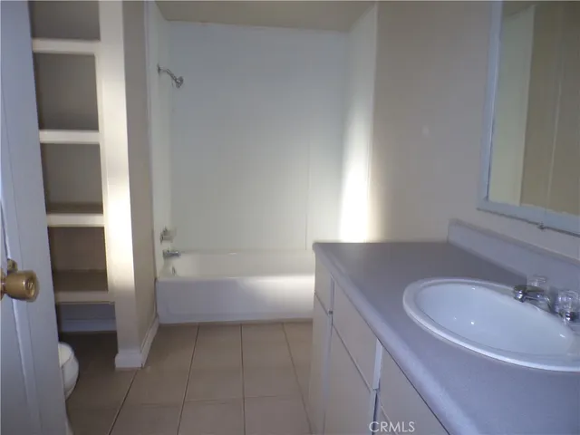 a bathroom with a toilet and a bathtub