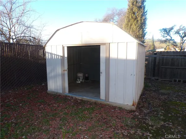 a view of back yard of a house