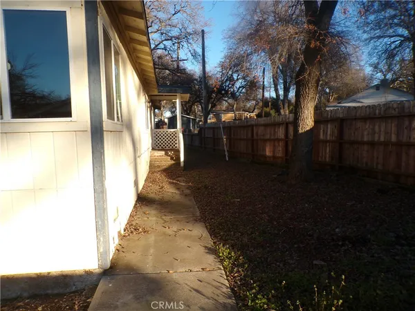 a kitchen with a sink a counter top space and cabinets