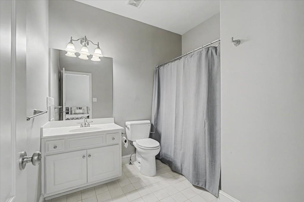 122 Ridge View Drive Ball Ground, GA 30107 - Photo 46 of 84 a bathroom with a toilet a sink and a mirror