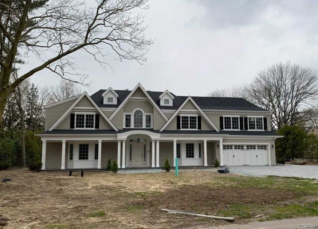 45 Cardinal Road Manhasset, NY 11030 - Photo 1 of 1 a front view of a house with a garden
