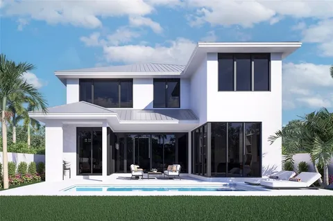 a view of a house with a yard outdoor seating and a tree