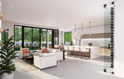 a living room with furniture and large windows