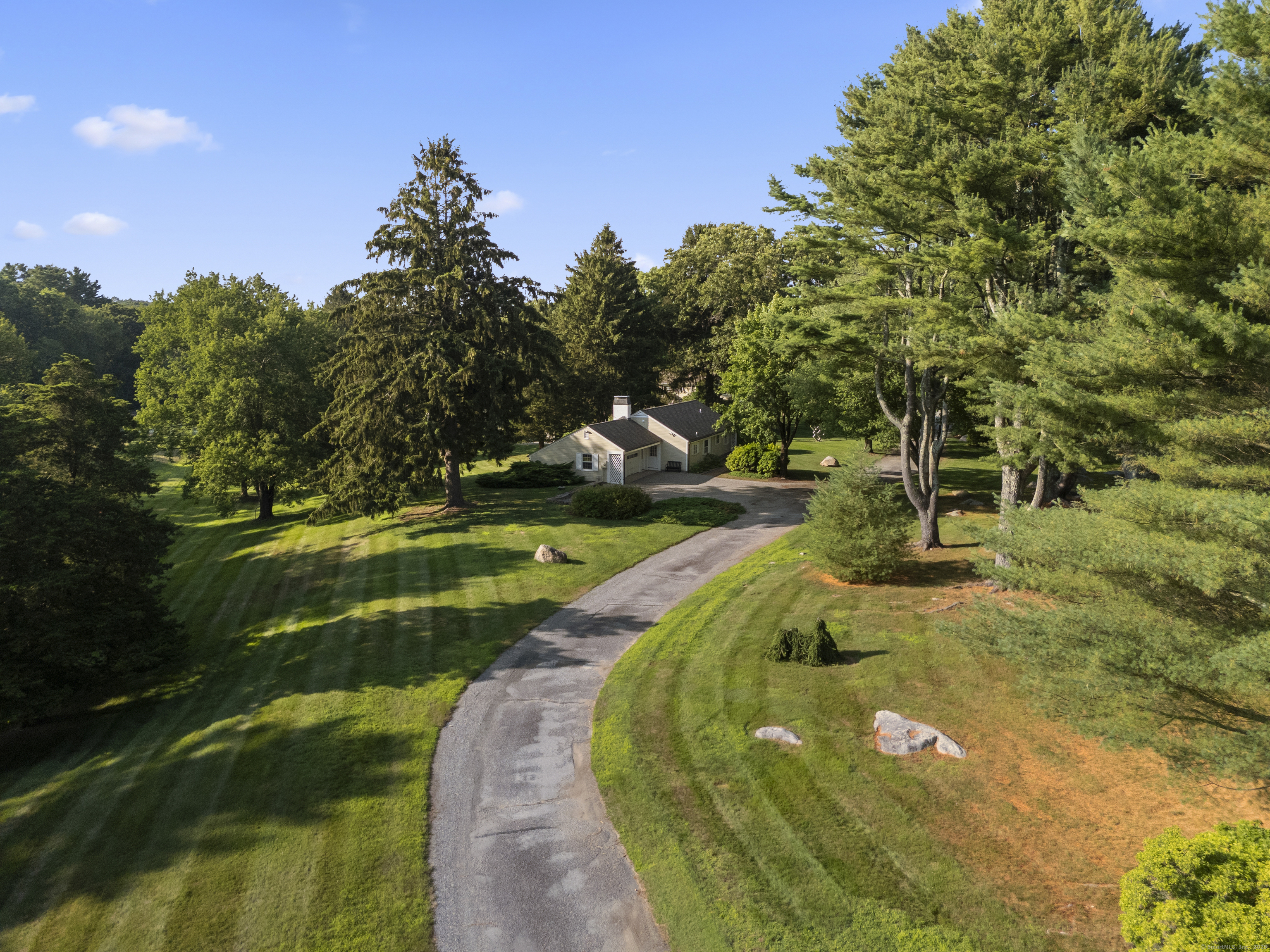 455 Stonington Road Stonington, CT 06378 - Photo 6 of 39 a view of a swimming pool with a yard and plants