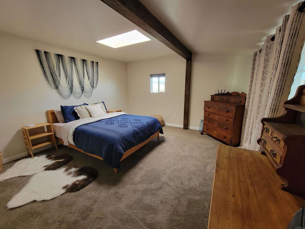 37304 Montezuma Valley Road Ranchita, CA 92066 - Photo 20 of 35 a bedroom with a bed and wooden floor
