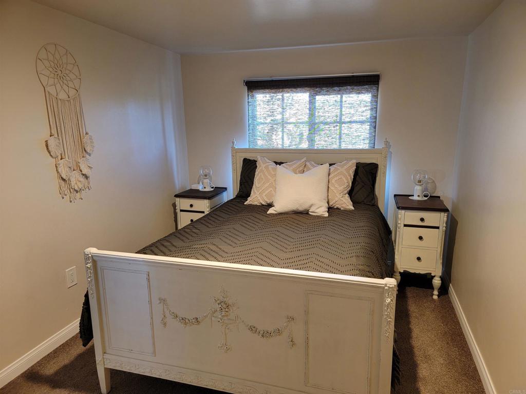 37304 Montezuma Valley Road Ranchita, CA 92066 - Photo 24 of 35 a bed sitting in a bedroom next to a window