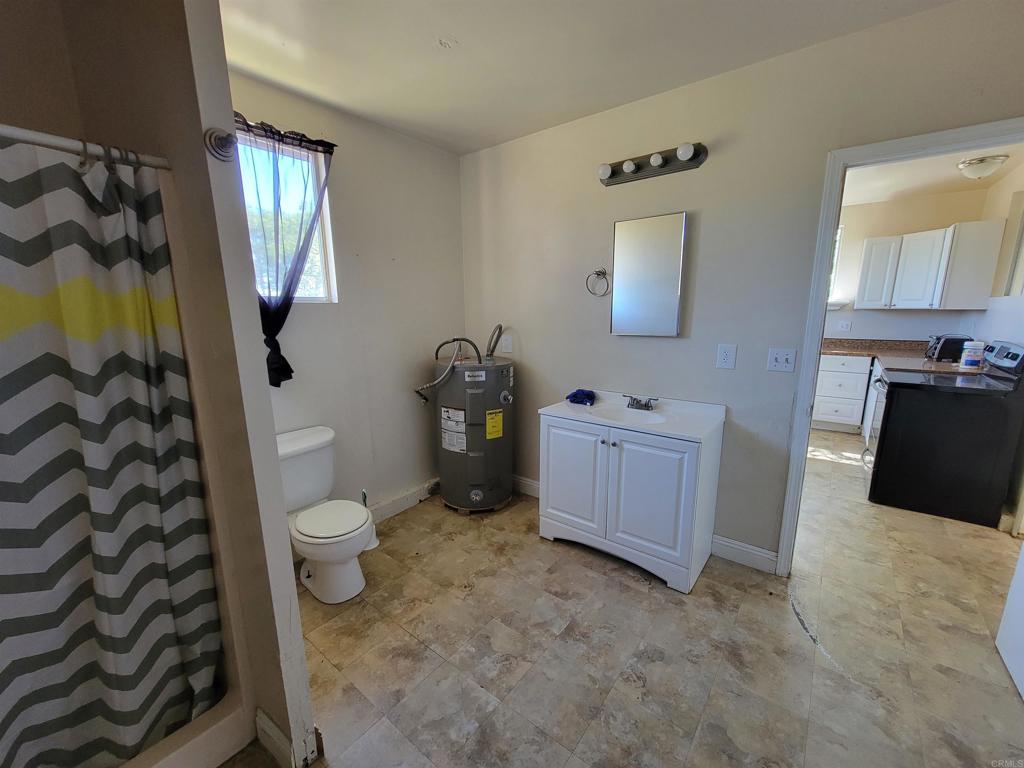 37304 Montezuma Valley Road Ranchita, CA 92066 - Photo 33 of 35 a bathroom with a sink toilet and mirror
