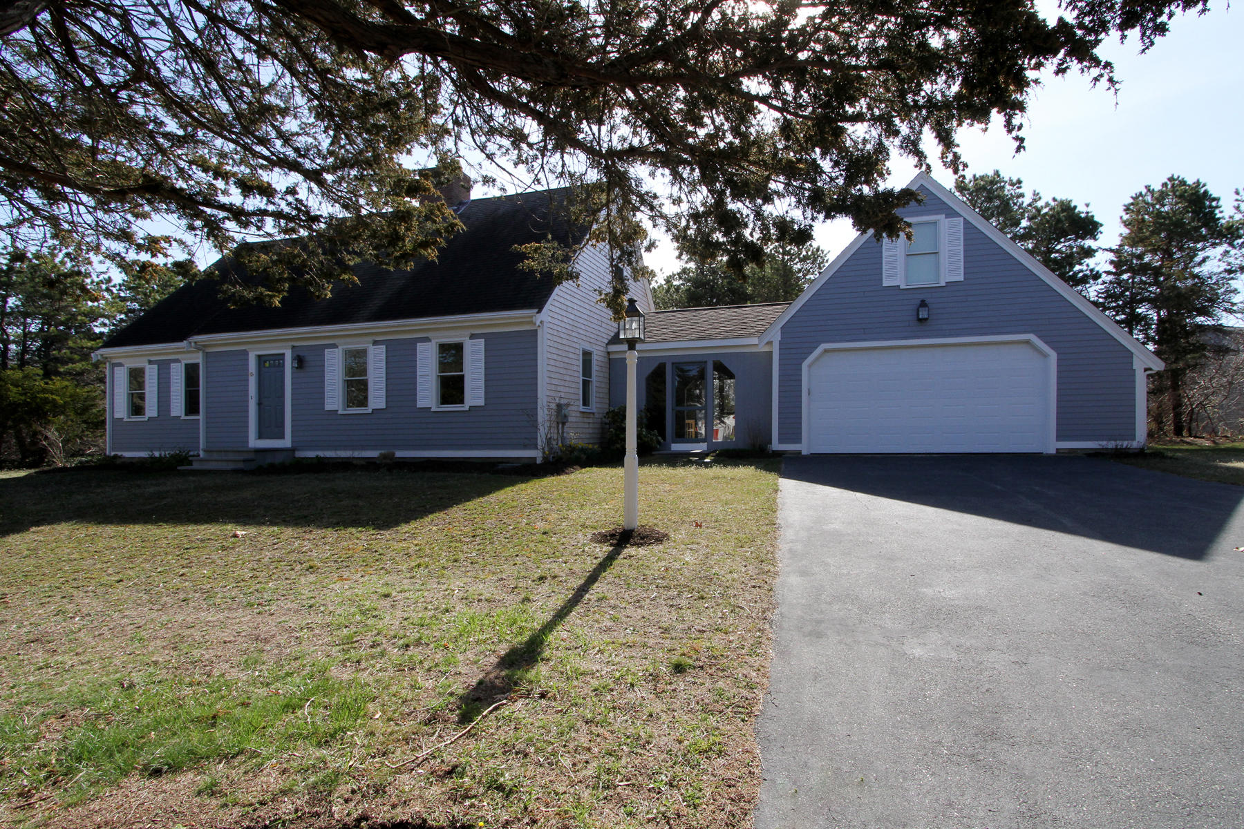 45 Doane Road Harwich Port, MA 02646 - Photo 1 of 35 front view of a house with a yard