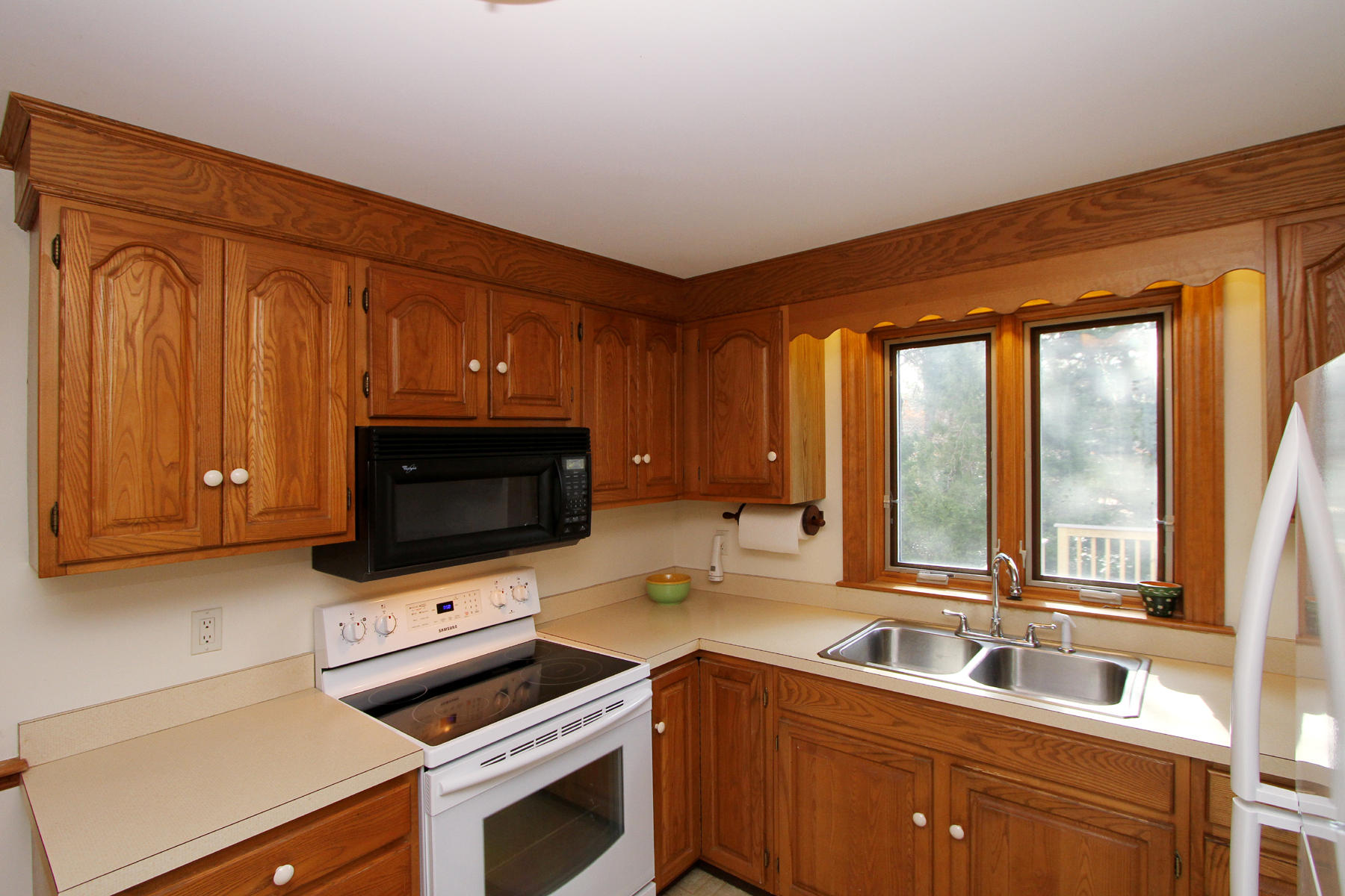 45 Doane Road Harwich Port, MA 02646 - Photo 11 of 35 a kitchen with a stove a sink and a microwave