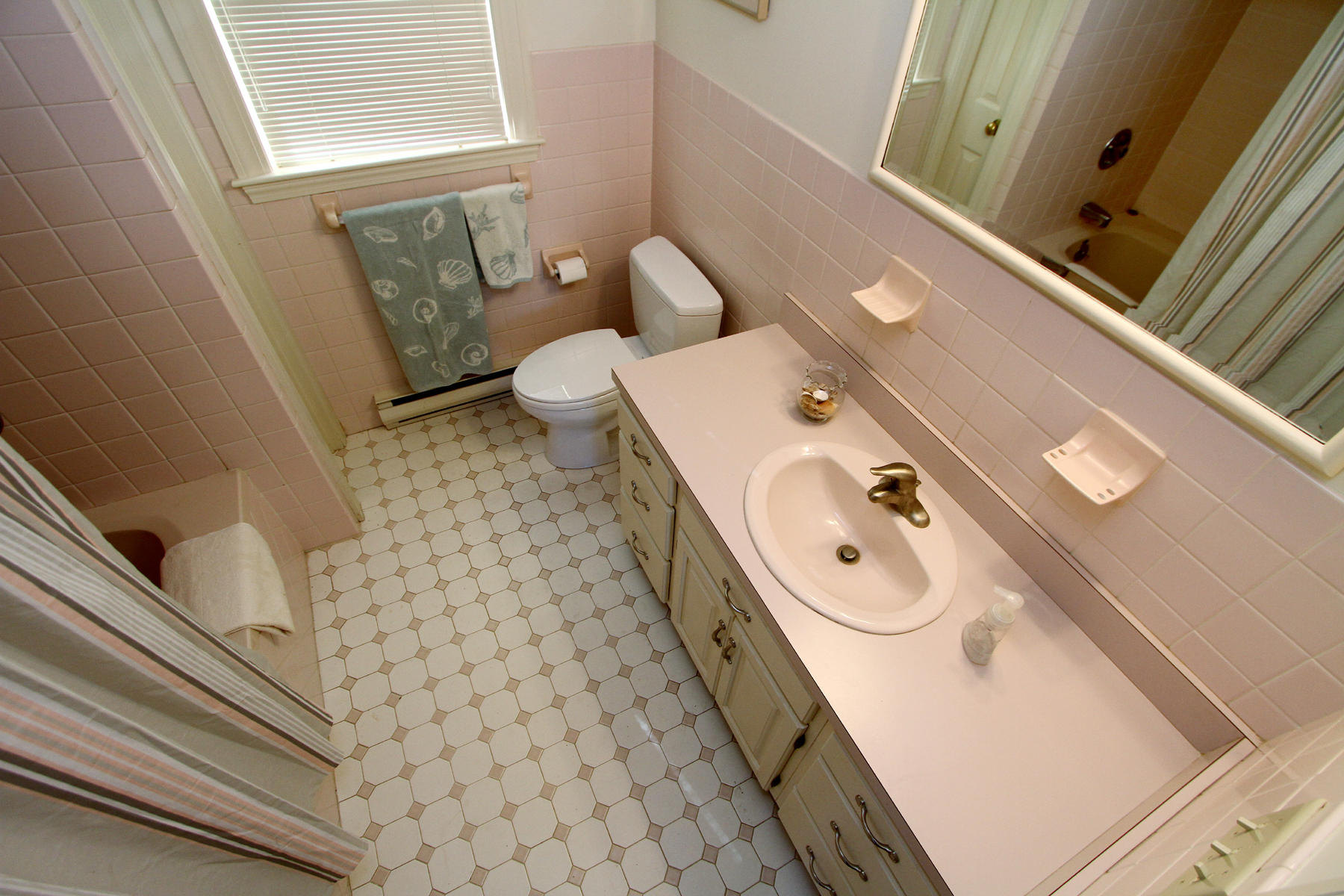 45 Doane Road Harwich Port, MA 02646 - Photo 15 of 35 a bathroom with a sink a toilet and a window