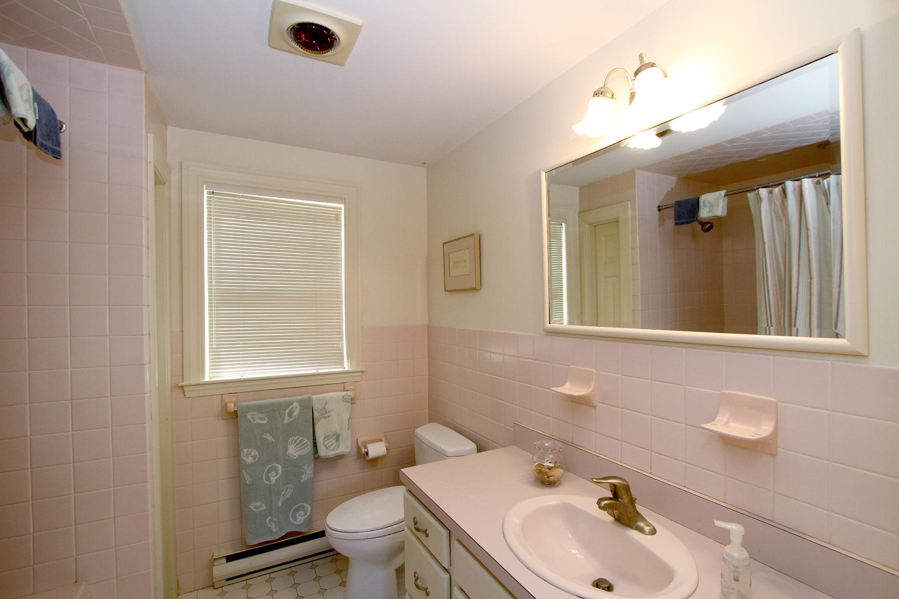 45 Doane Road Harwich Port, MA 02646 - Photo 16 of 35 a bathroom with a sink mirror and toilet