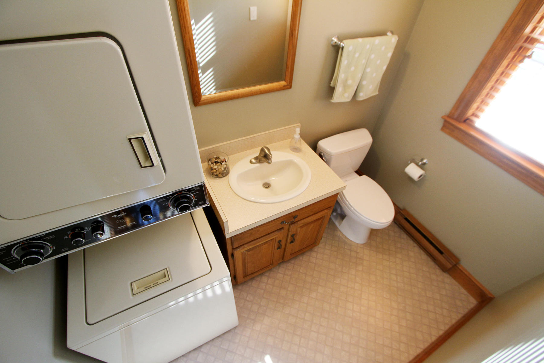 45 Doane Road Harwich Port, MA 02646 - Photo 17 of 35 a bathroom with a sink a toilet and a mirror
