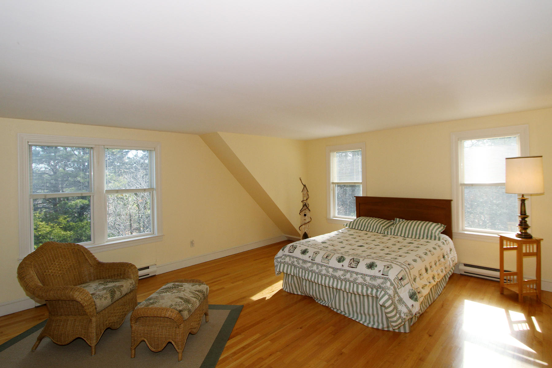 45 Doane Road Harwich Port, MA 02646 - Photo 20 of 35 a bedroom with a bed and chair