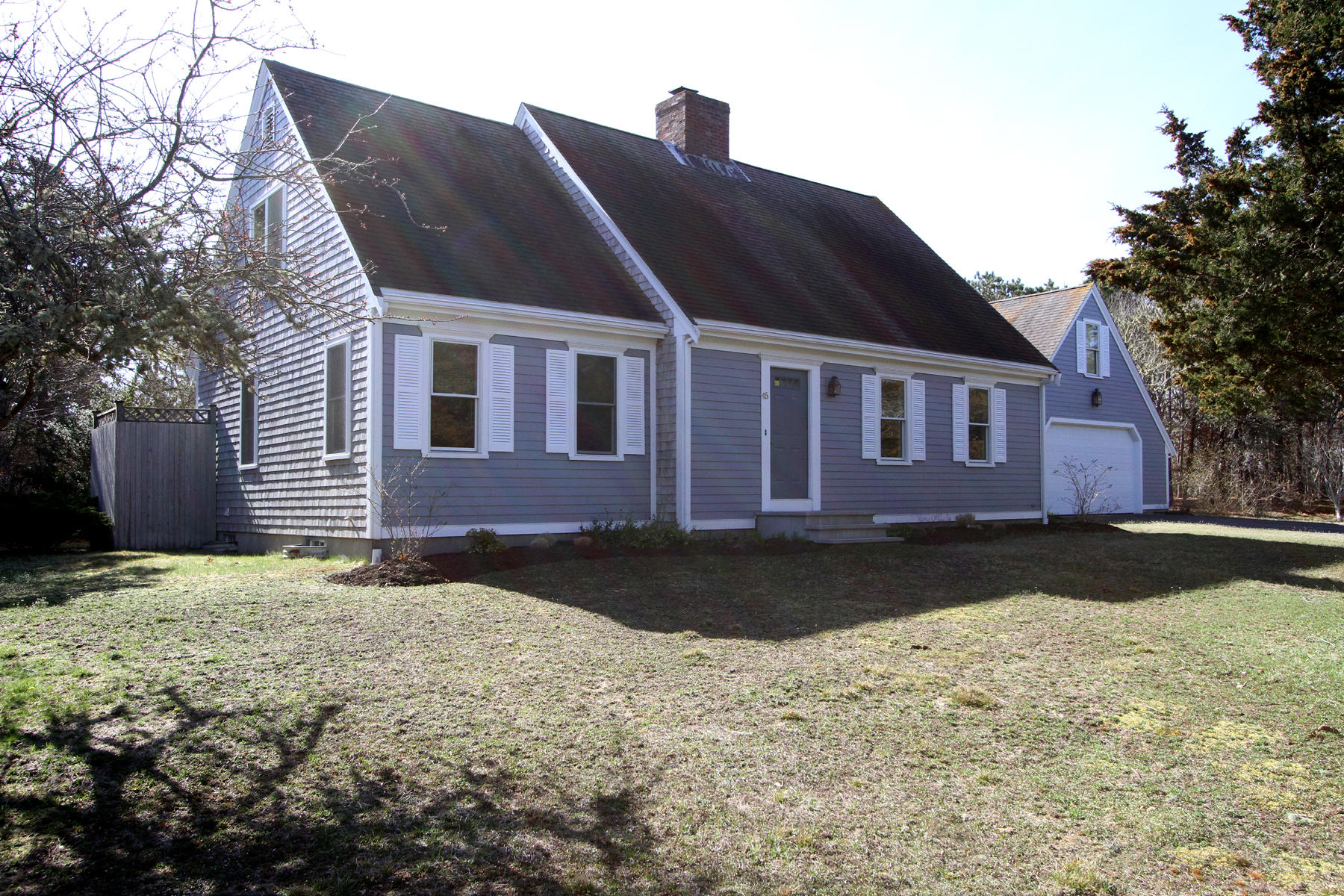 45 Doane Road Harwich Port, MA 02646 - Photo 2 of 35 a front view of a house with a yard