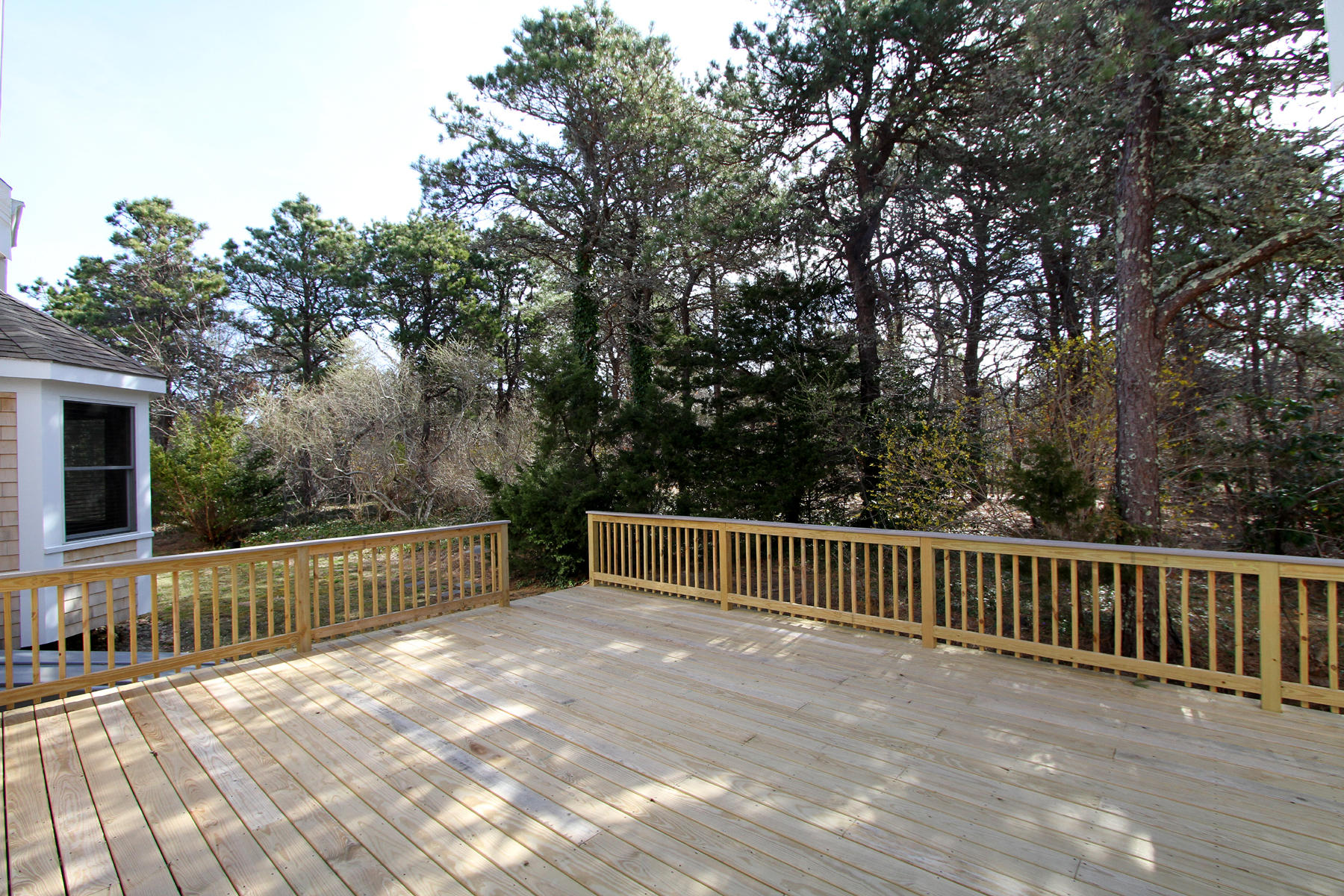 45 Doane Road Harwich Port, MA 02646 - Photo 30 of 35 a view of a deck with a yard