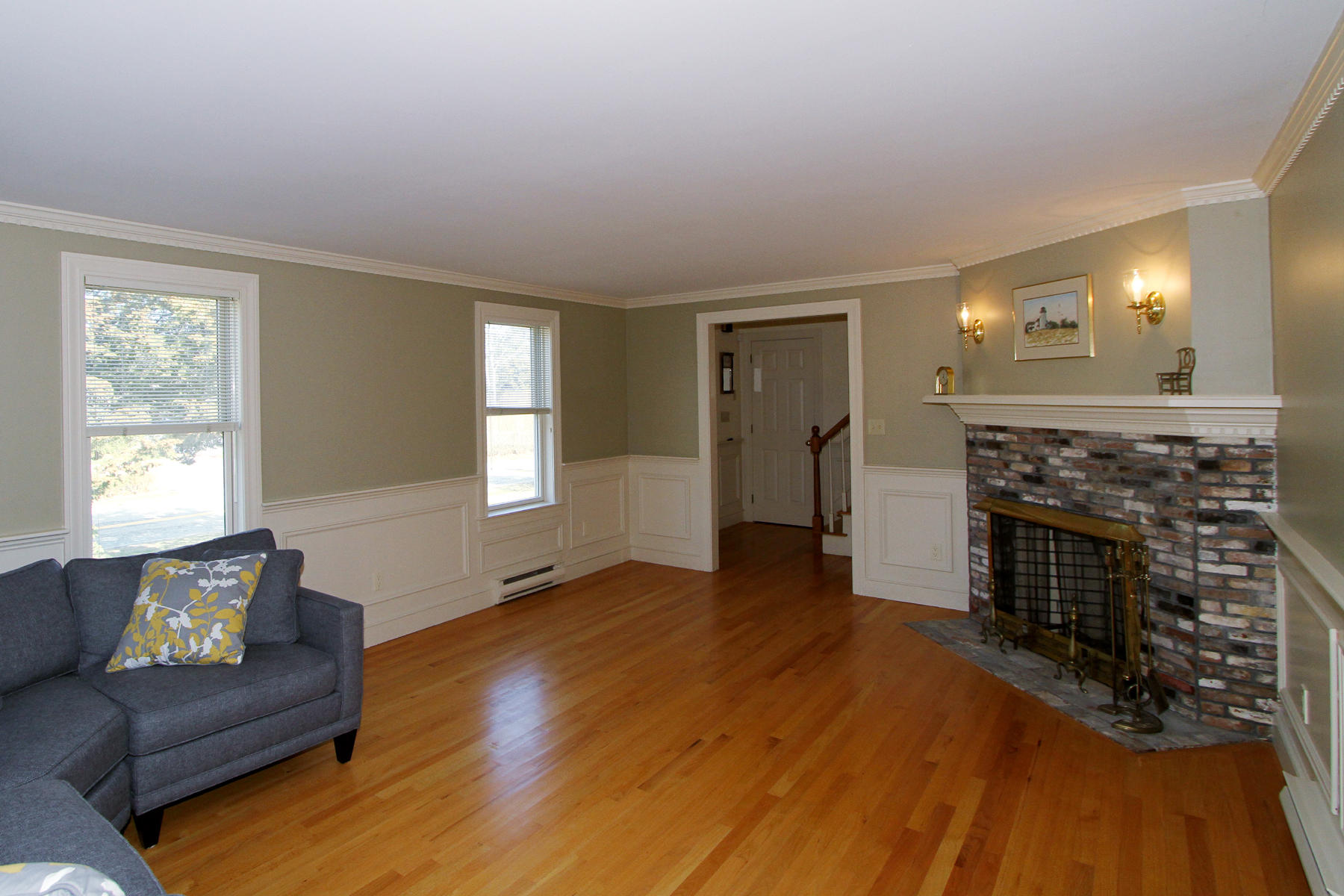 45 Doane Road Harwich Port, MA 02646 - Photo 4 of 35 a living room with furniture and a fireplace