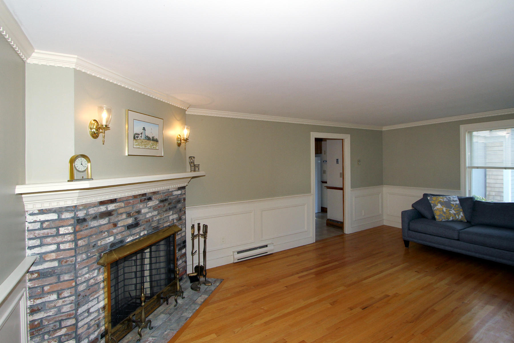 45 Doane Road Harwich Port, MA 02646 - Photo 5 of 35 a living room with furniture and a fireplace