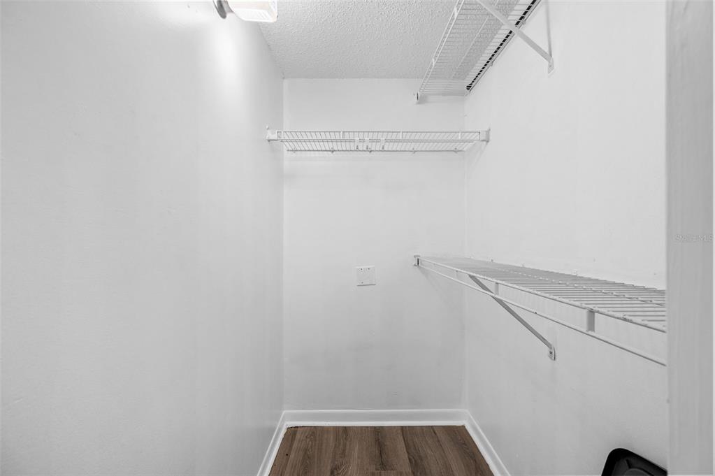 3921 Southwest 34th Street, Unit 208 Gainesville, FL 32608 - Photo 14 of 33 a view of walk in closet with empty racks