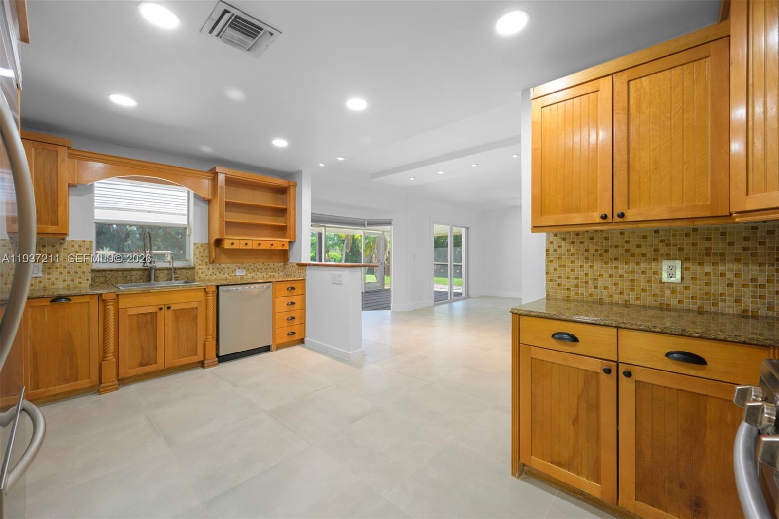 5300 Southwest 162nd Avenue Southwest Ranches, FL 33331 - Photo 16 of 43 a kitchen with a sink wooden cabinets and counter top space