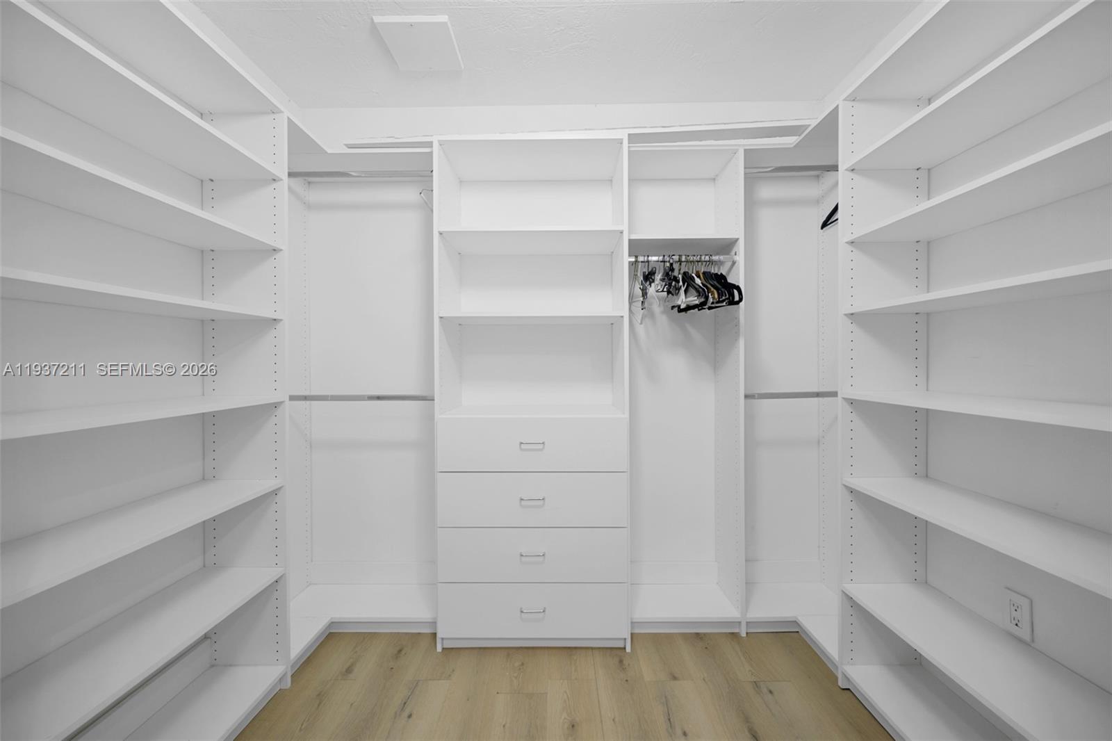 5300 Southwest 162nd Avenue Southwest Ranches, FL 33331 - Photo 22 of 43 a view of walk in closet with empty racks