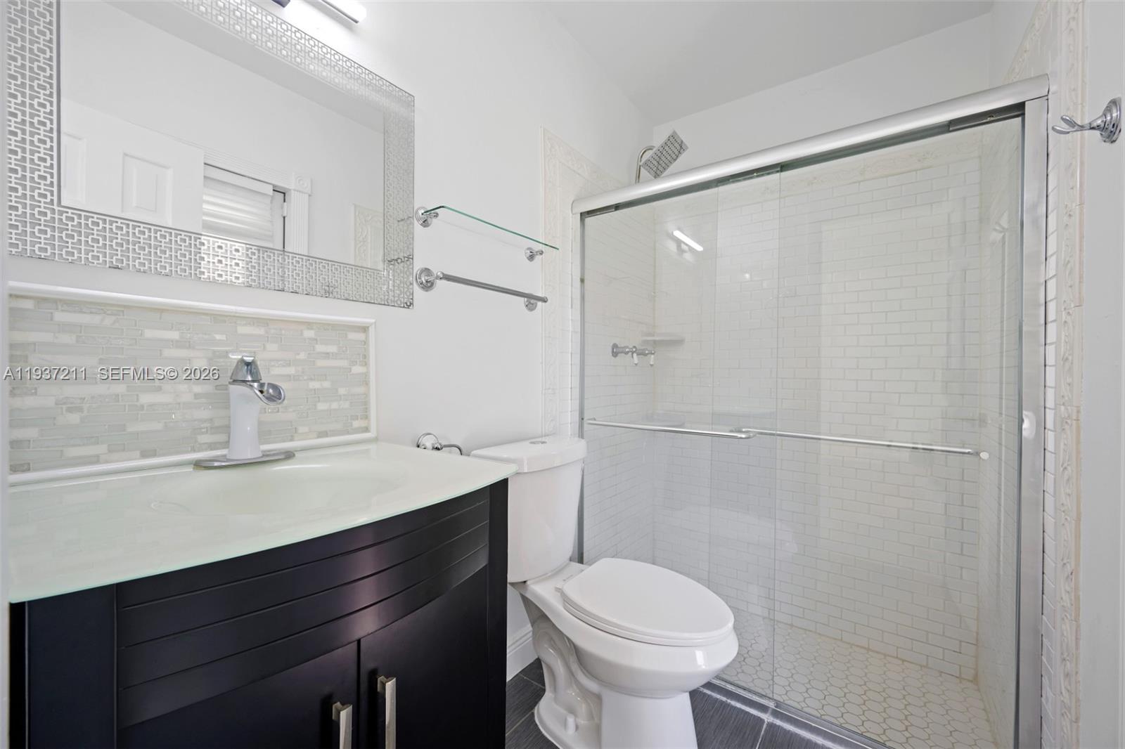 5300 Southwest 162nd Avenue Southwest Ranches, FL 33331 - Photo 26 of 43 a bathroom with a sink a toilet and shower