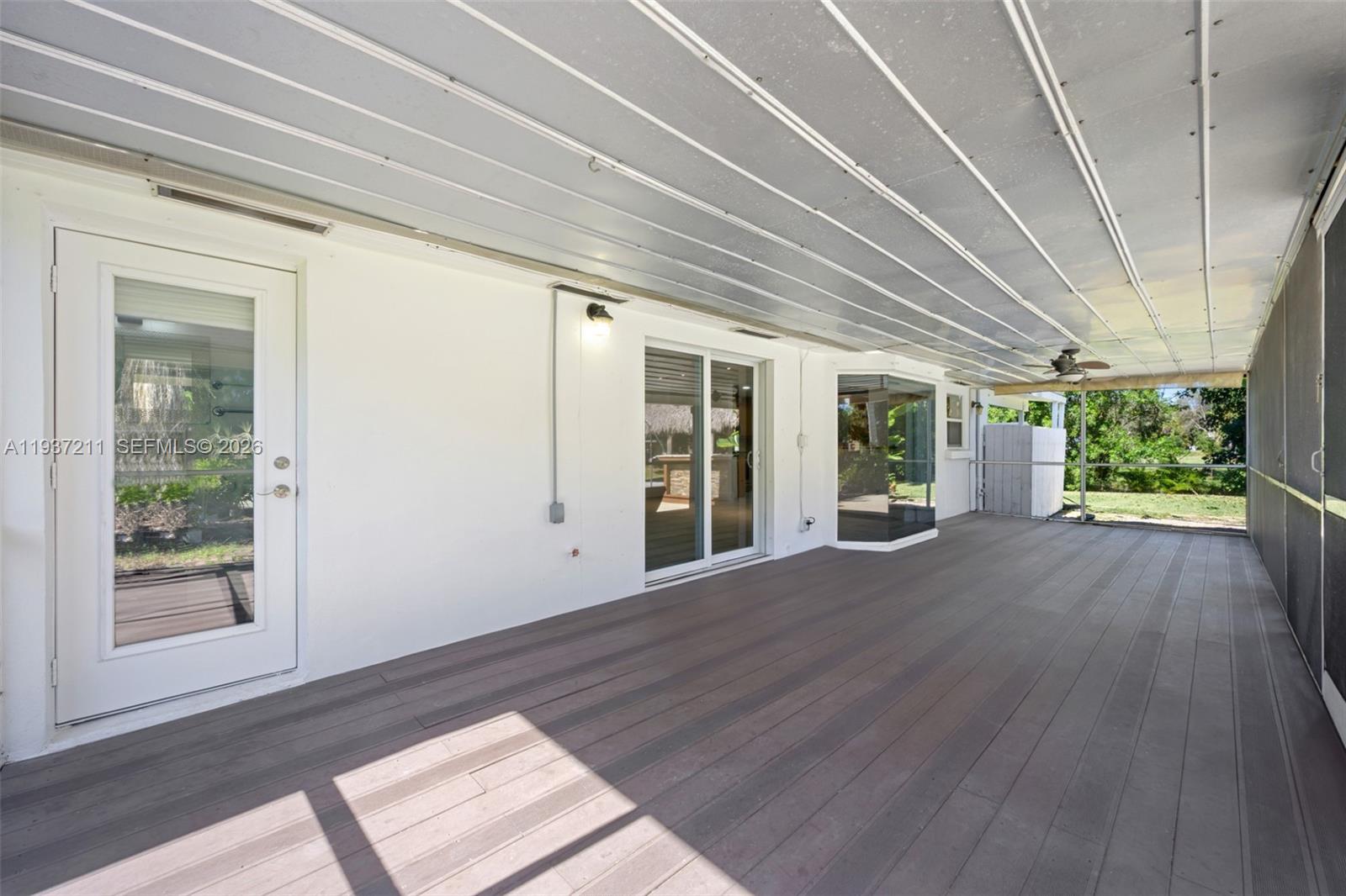 5300 Southwest 162nd Avenue Southwest Ranches, FL 33331 - Photo 32 of 43 a view of an empty room with wooden floor and a window