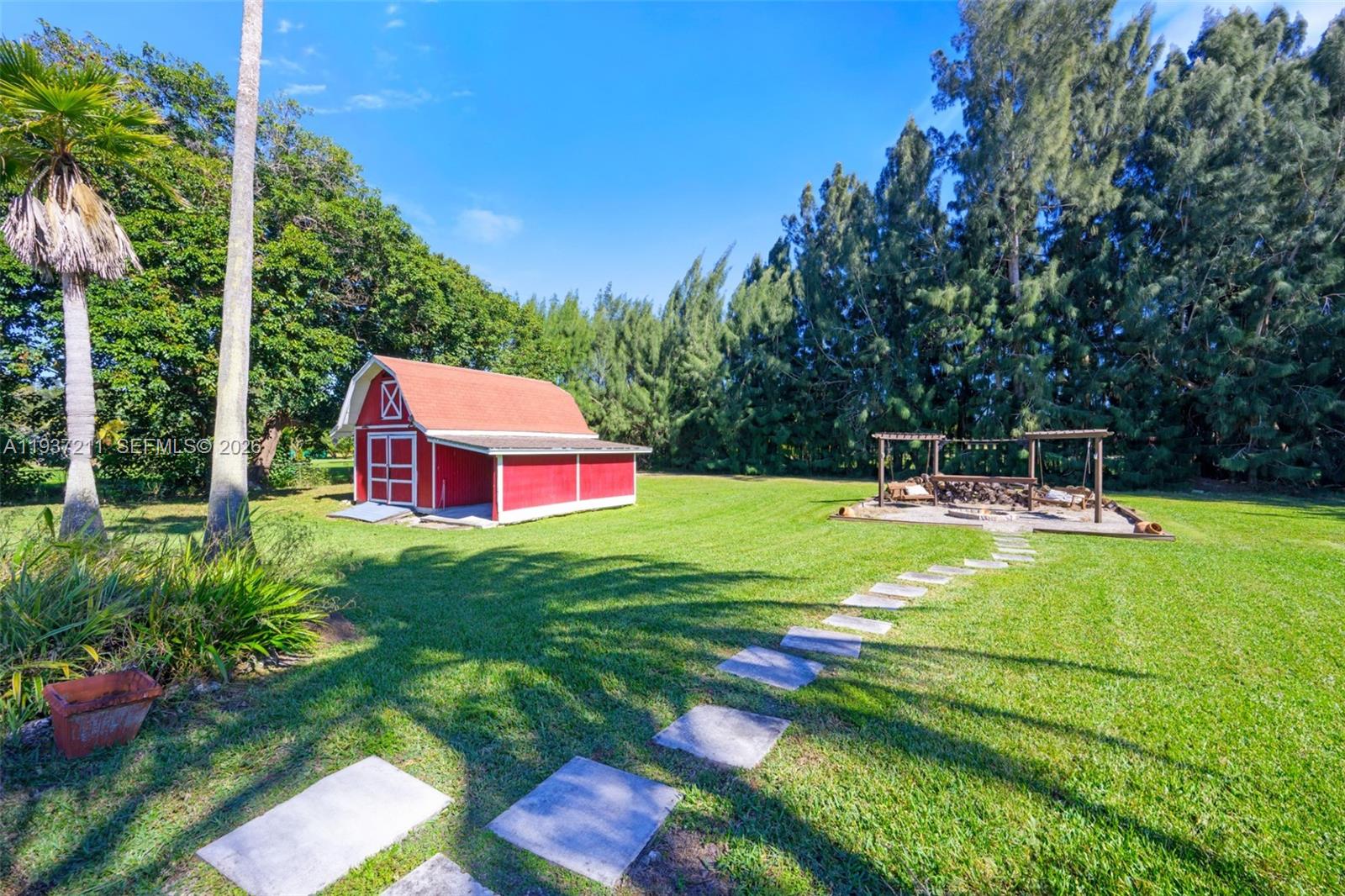 5300 Southwest 162nd Avenue Southwest Ranches, FL 33331 - Photo 36 of 43 a view of a backyard with a garden
