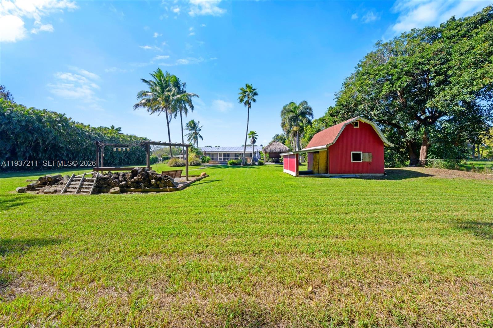 5300 Southwest 162nd Avenue Southwest Ranches, FL 33331 - Photo 37 of 43 a view of a house with a big yard