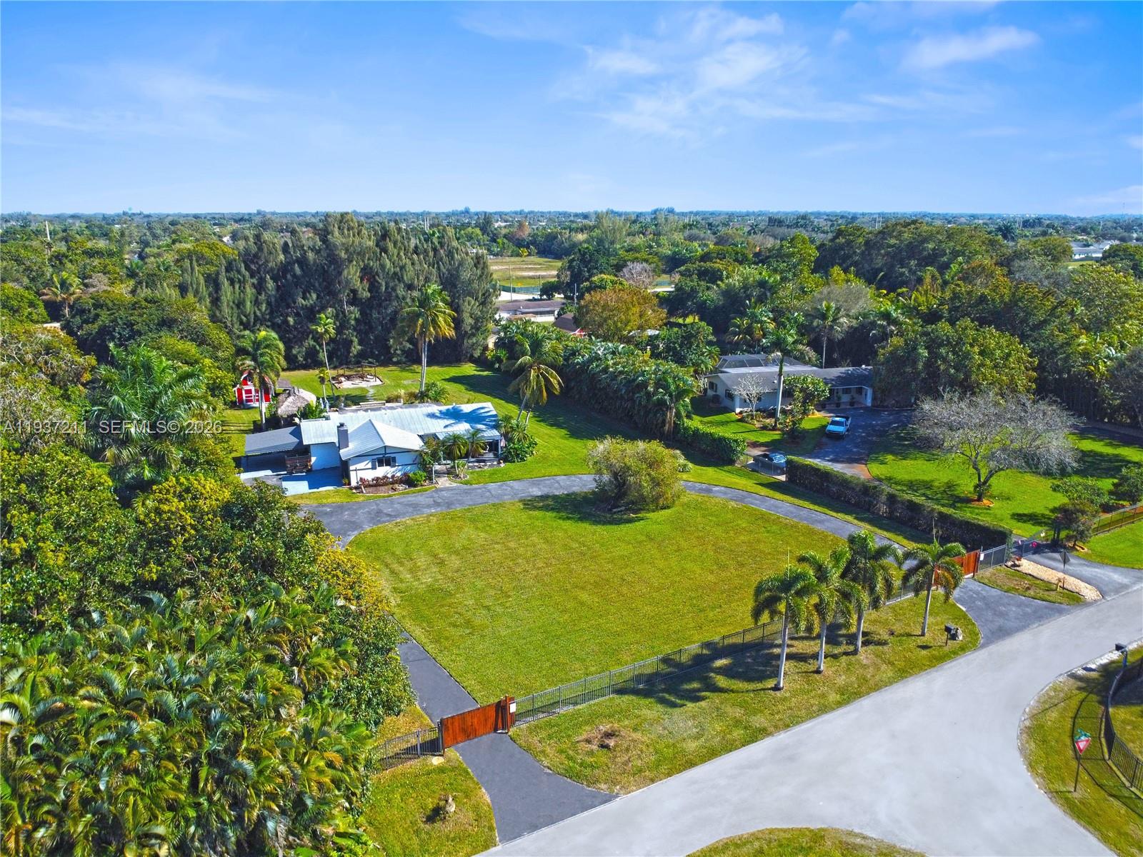 5300 Southwest 162nd Avenue Southwest Ranches, FL 33331 - Photo 40 of 43 an aerial view of a residential houses with outdoor space and street view