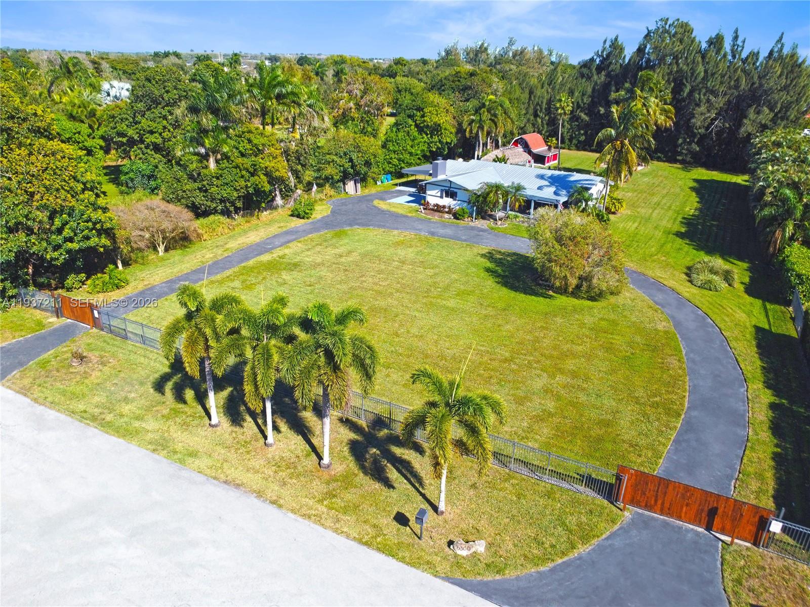 5300 Southwest 162nd Avenue Southwest Ranches, FL 33331 - Photo 41 of 43 a view of a swimming pool with a yard