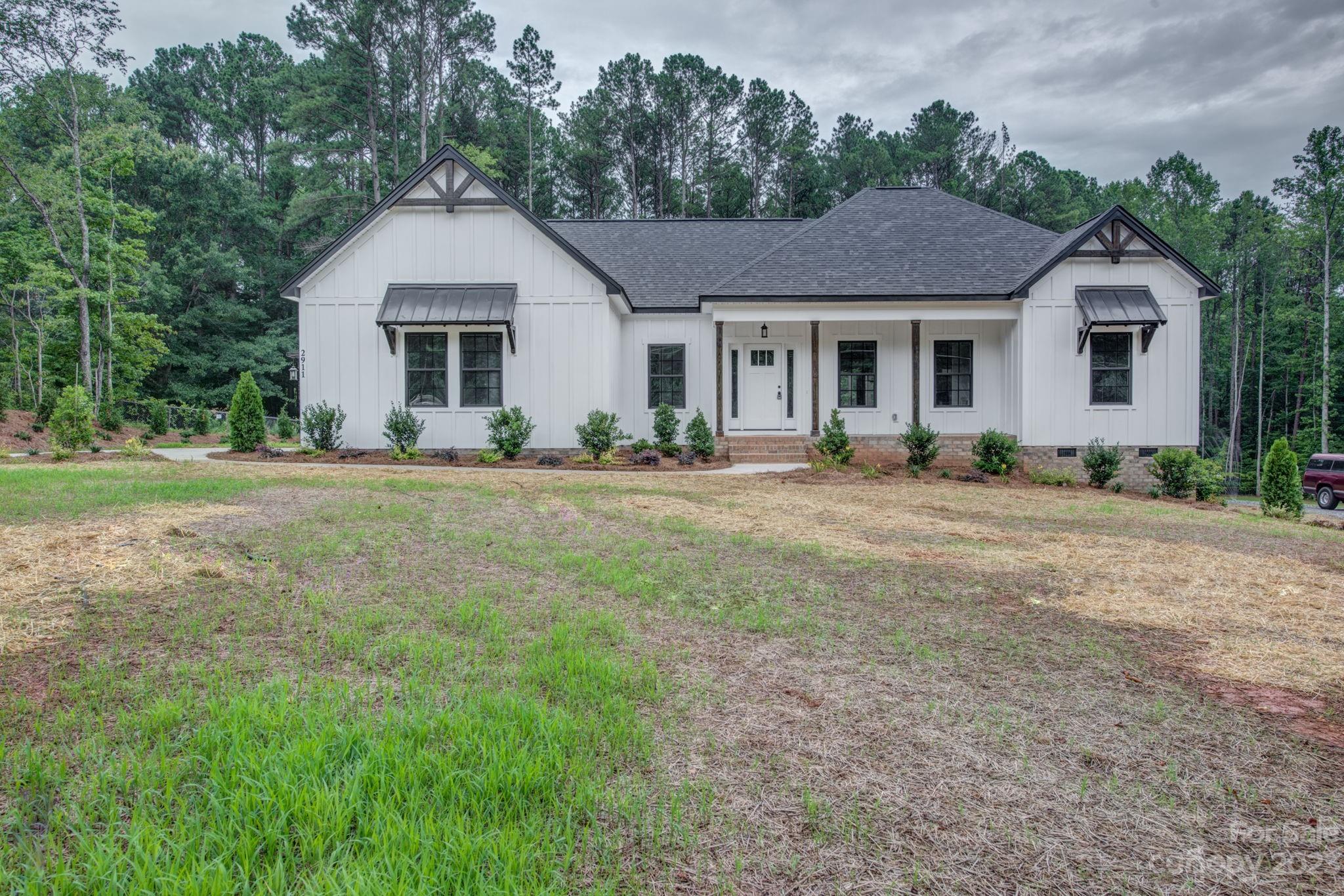 2911 Sparrow Springs Road Gastonia, NC 28052 - Photo 1 of 31 a front view of a house with a yard