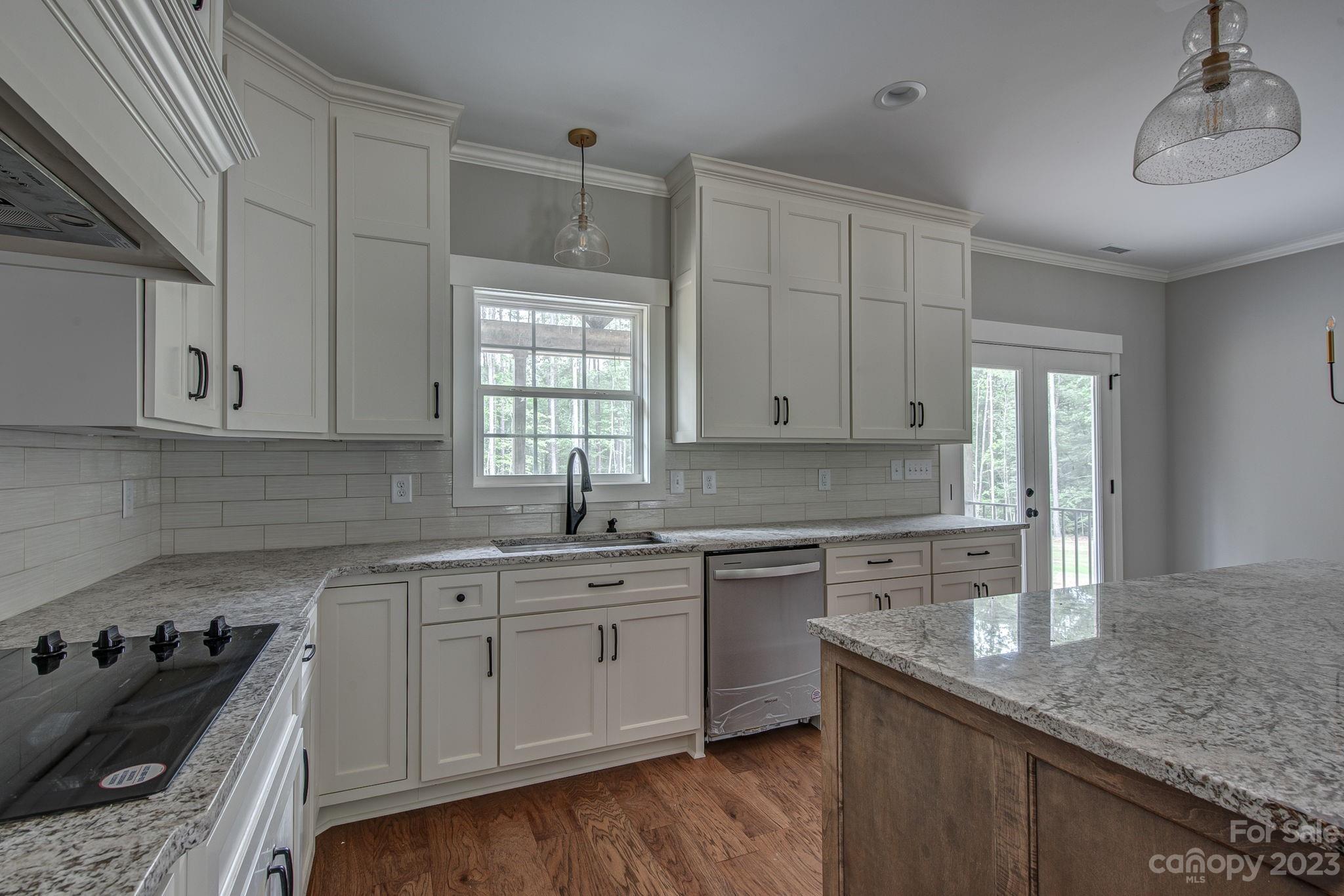 2911 Sparrow Springs Road Gastonia, NC 28052 - Photo 11 of 31 a kitchen with a sink stove and cabinets