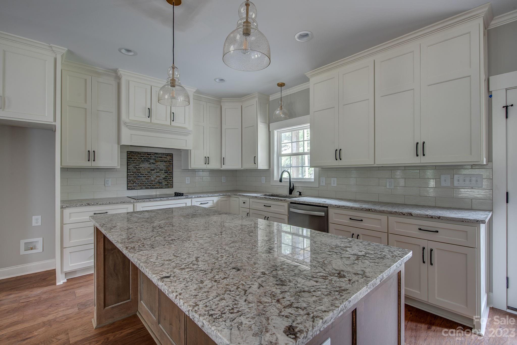 2911 Sparrow Springs Road Gastonia, NC 28052 - Photo 12 of 31 a kitchen with granite countertop a center island and cabinets