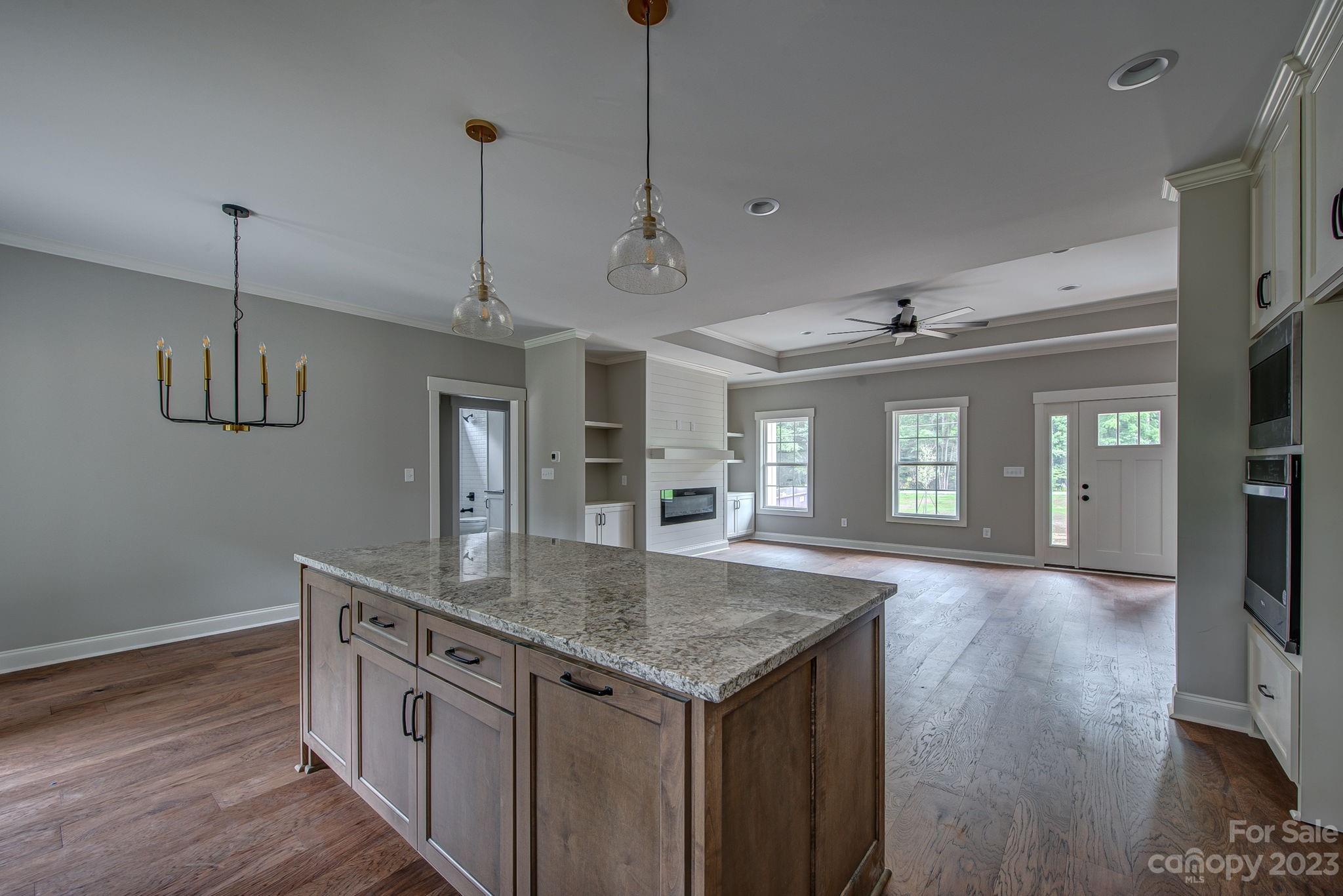 2911 Sparrow Springs Road Gastonia, NC 28052 - Photo 16 of 31 a kitchen with stainless steel appliances granite countertop stove top oven and refrigerator