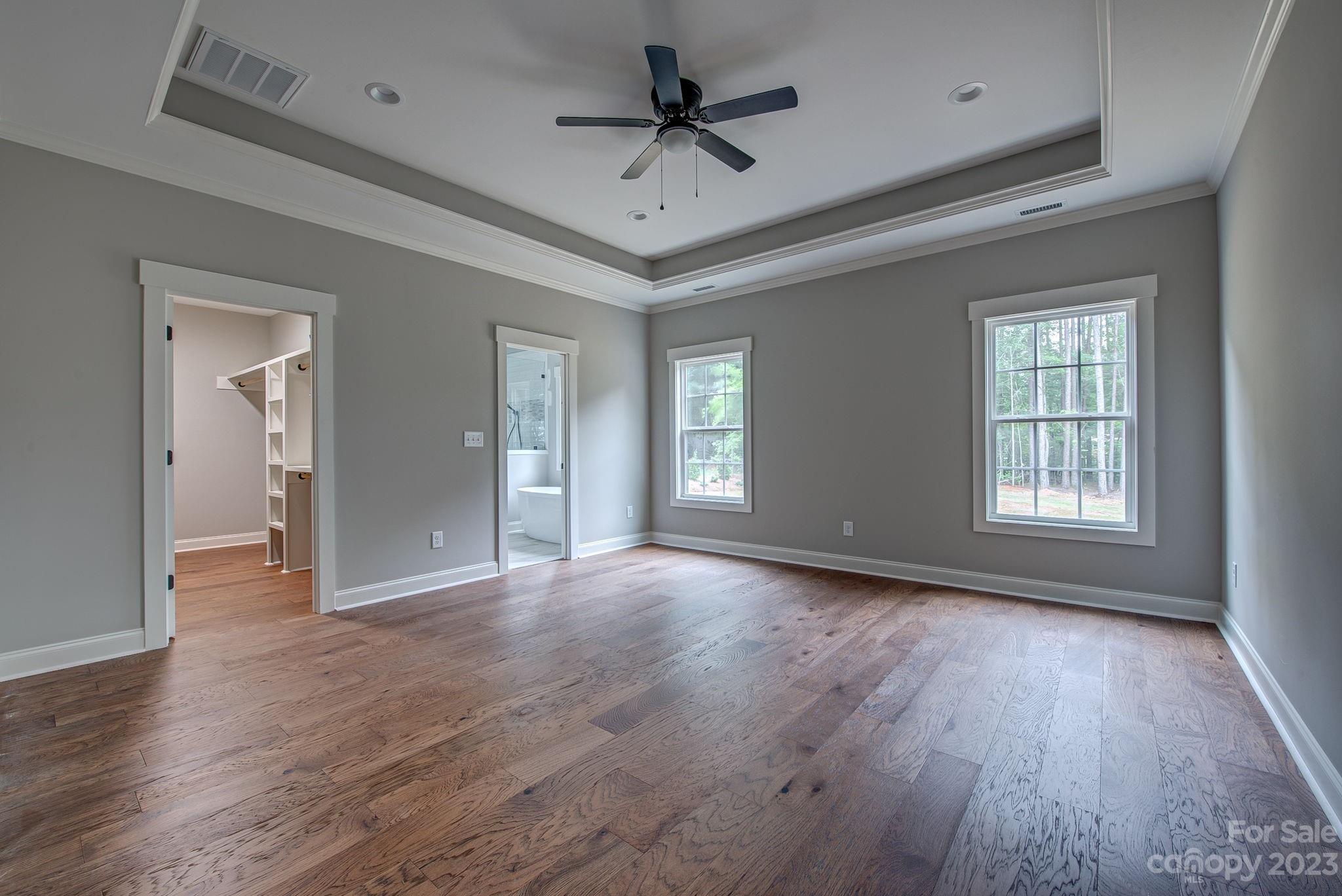 2911 Sparrow Springs Road Gastonia, NC 28052 - Photo 18 of 31 a view of an empty room with window and wooden floor