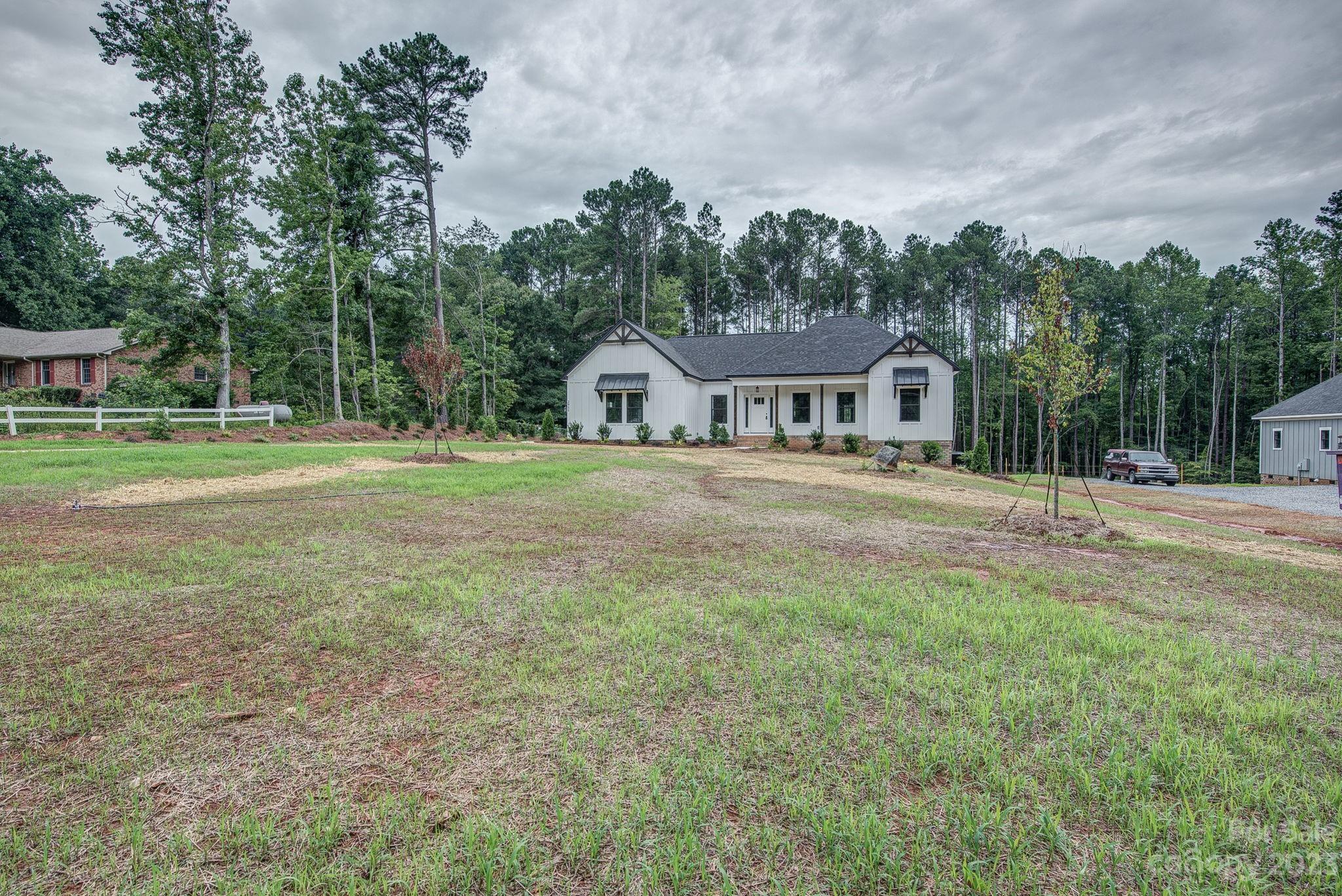 2911 Sparrow Springs Road Gastonia, NC 28052 - Photo 2 of 31 a house view with a garden space