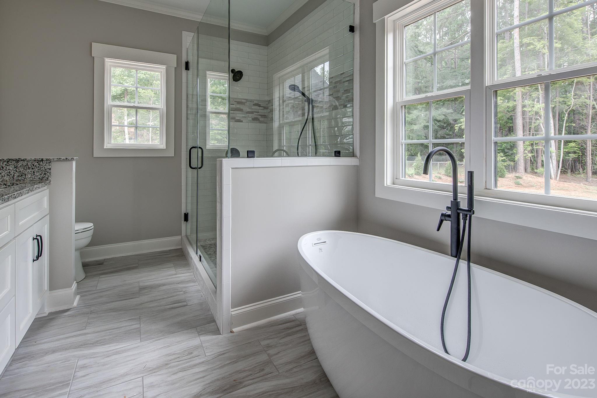 2911 Sparrow Springs Road Gastonia, NC 28052 - Photo 21 of 31 a view of bathroom with bathtub and shower