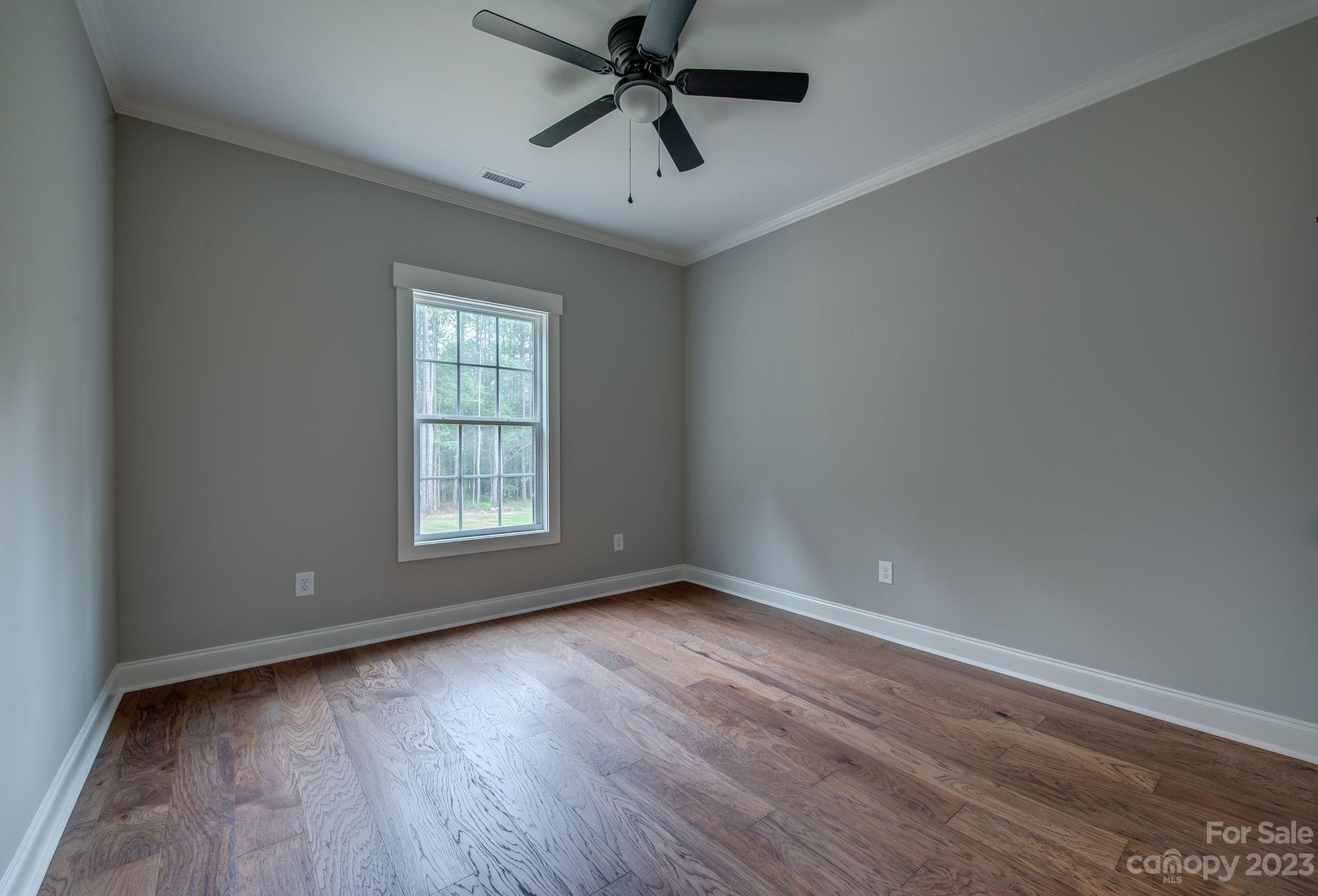 2911 Sparrow Springs Road Gastonia, NC 28052 - Photo 26 of 31 wooden floor in an empty room with a window