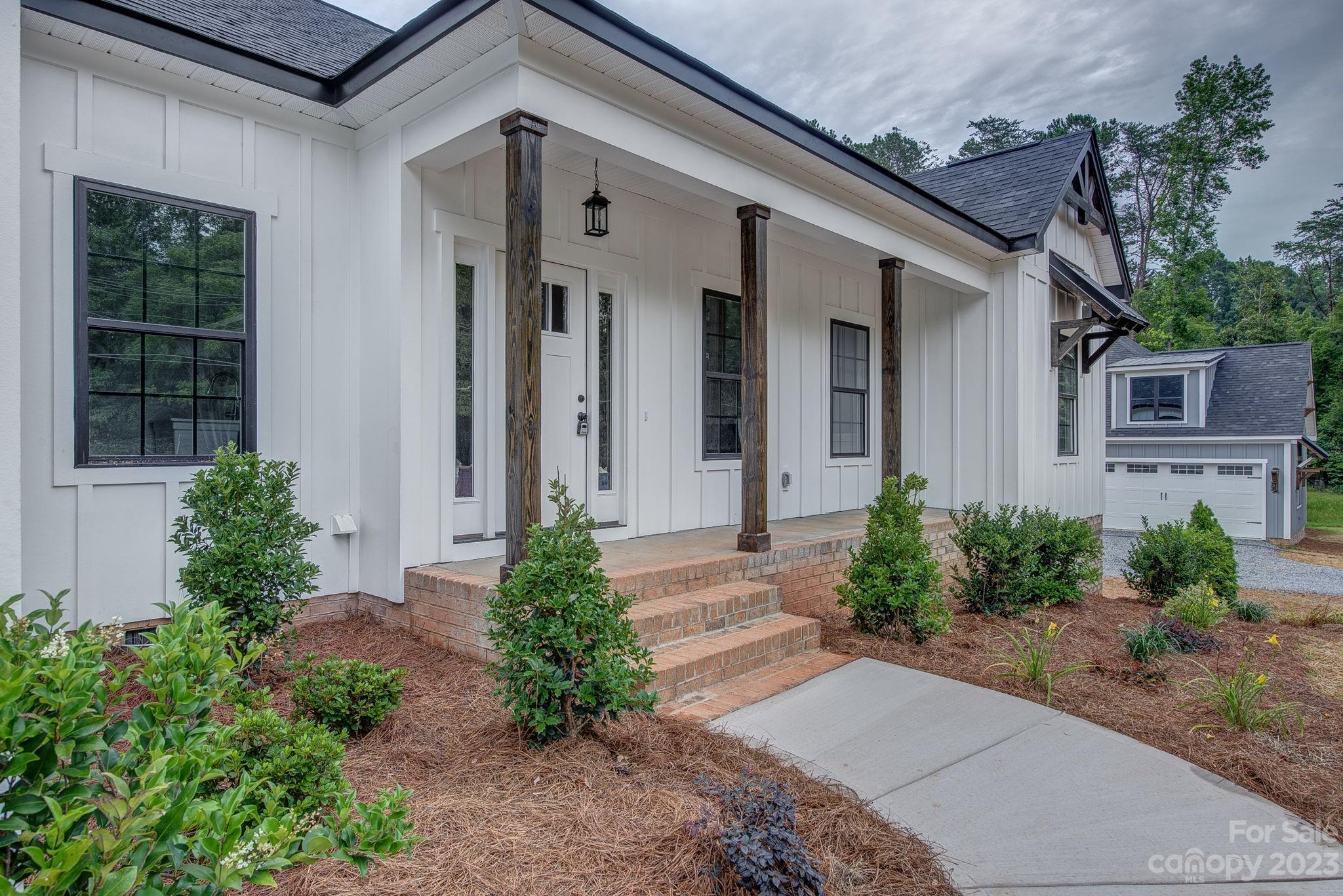 2911 Sparrow Springs Road Gastonia, NC 28052 - Photo 3 of 31 a front view of a house with garden