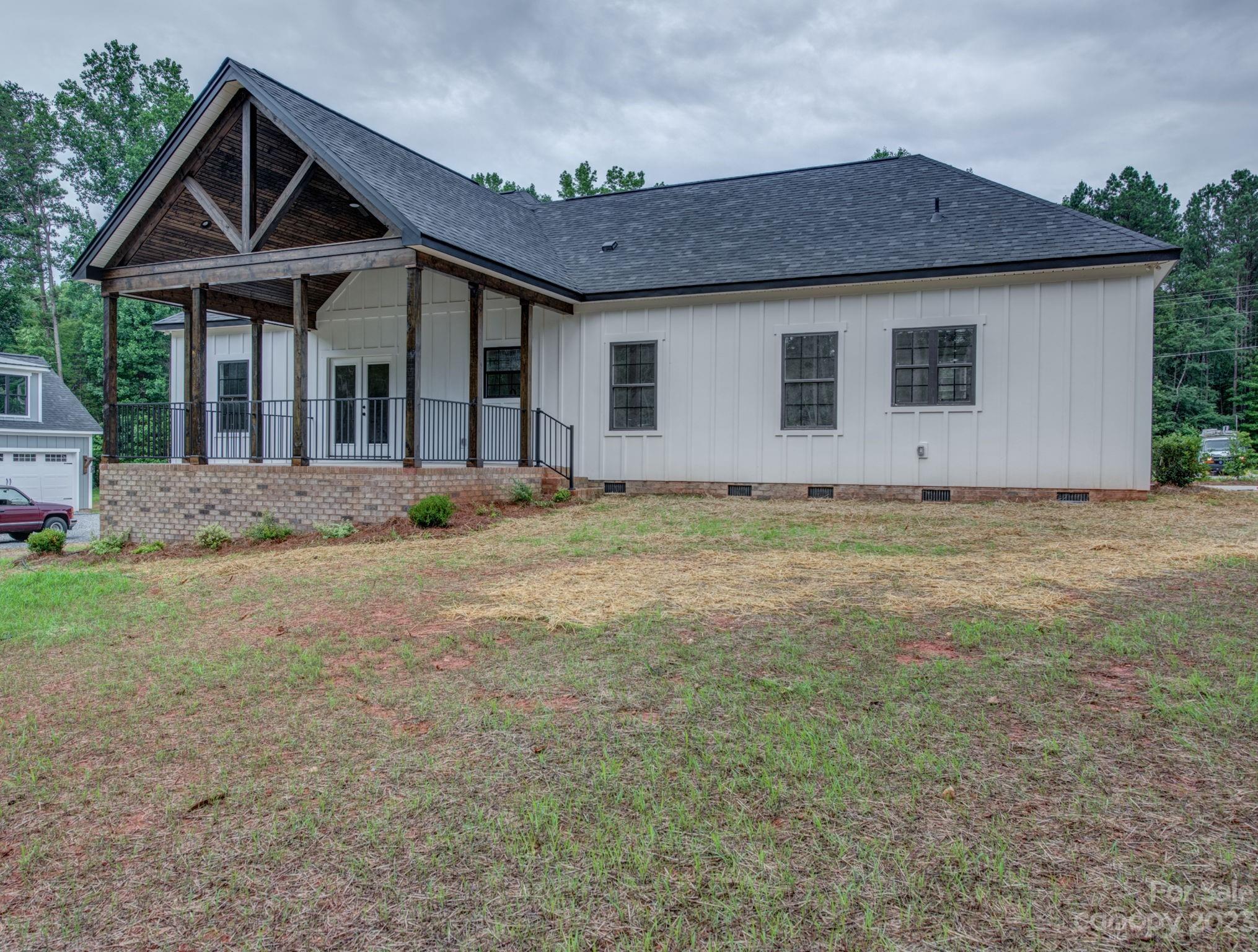2911 Sparrow Springs Road Gastonia, NC 28052 - Photo 4 of 31 a view of a house with a yard